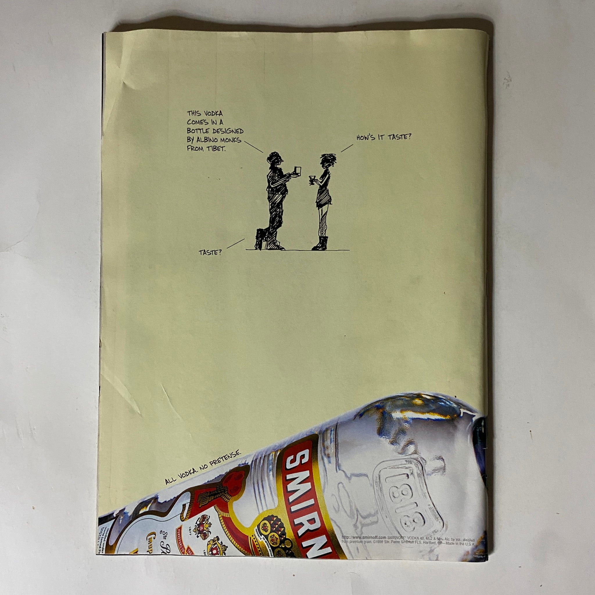 Back cover of Tennis Magazine May 1998, showcasing an advertisement with a humorous illustration related to vodka.
