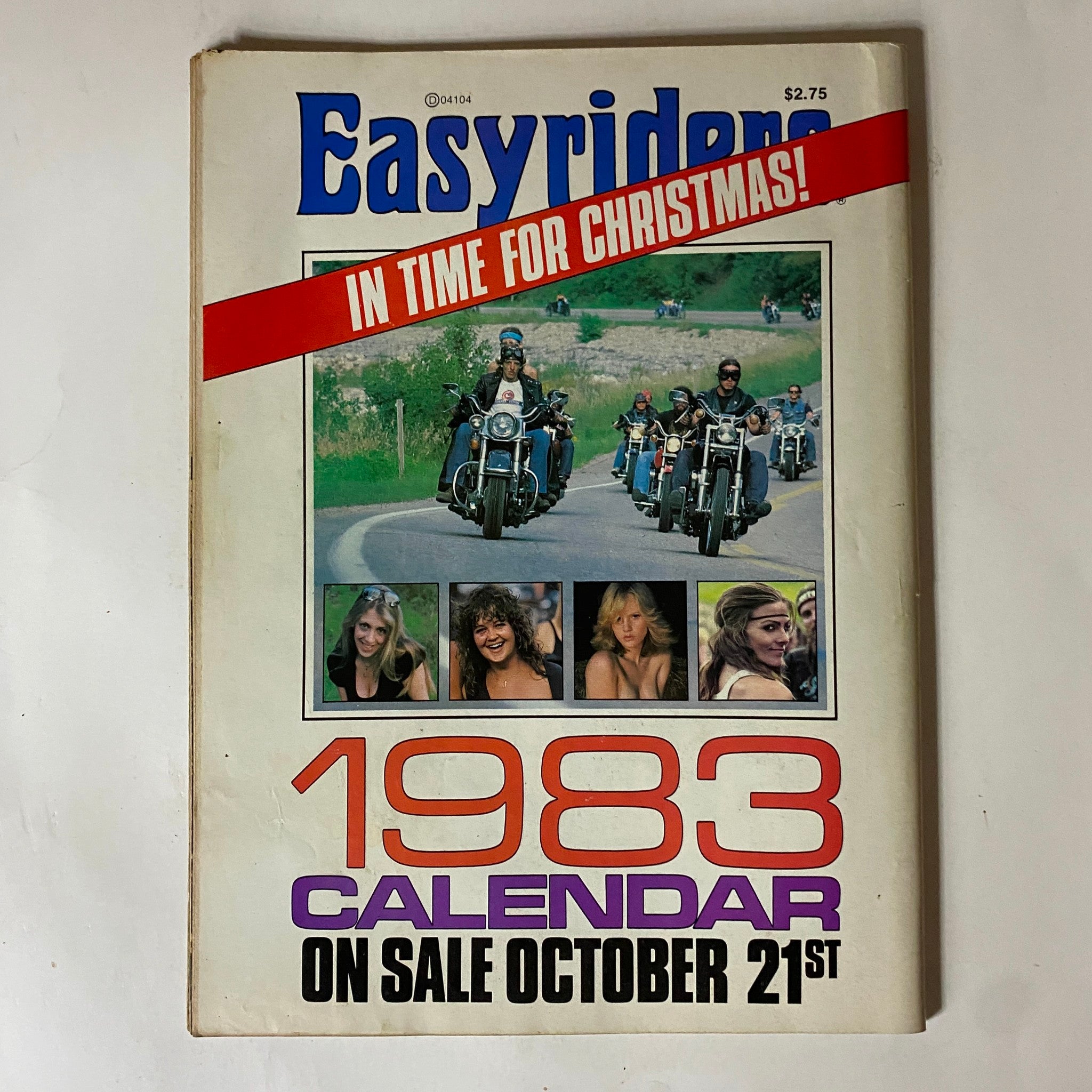 Cover of Easy Rider magazine featuring the title and a promotional banner for the 1983 calendar. The image displays a group of motorcyclists riding on a scenic road with photos of models below the title, relevant to the vintage themes of motorcycling and lifestyle.