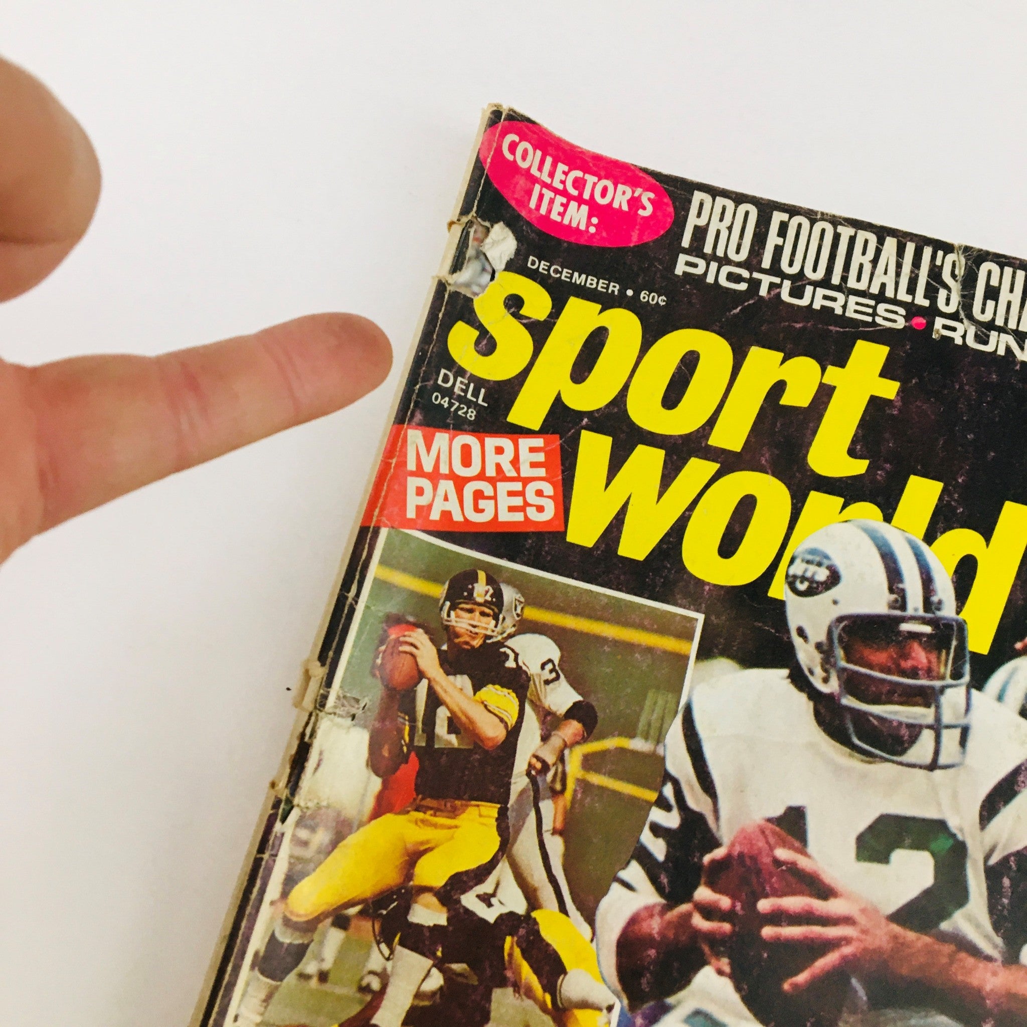Close-up view of the Sport World Magazine December 1973 cover, highlighting NFL quarterbacks Joe Namath and Terry Bradshaw with an emphasis on collectible items.