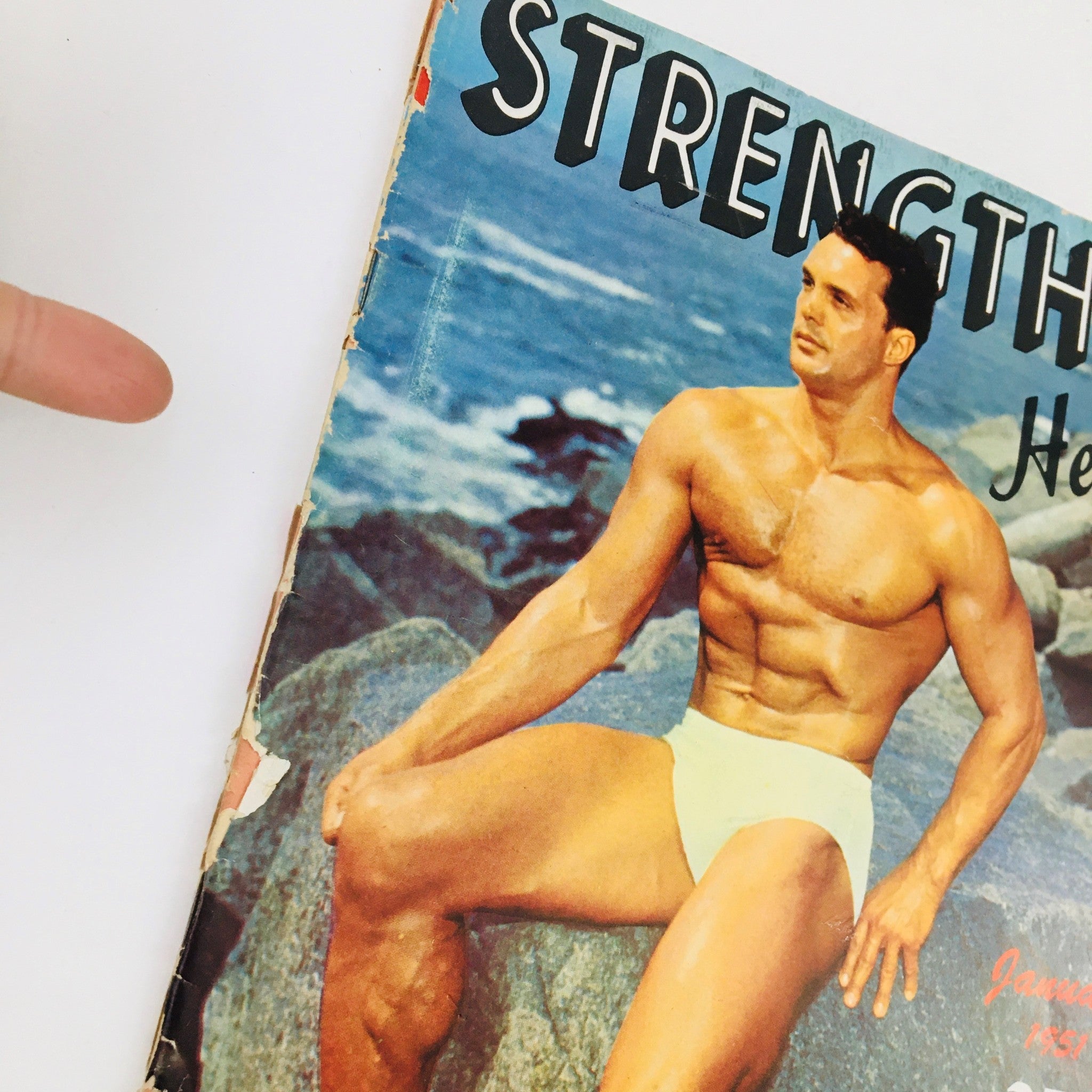 Close-up of the cover of Strength & Health Magazine January 1951 showcasing bodybuilder Victor Nicolett.