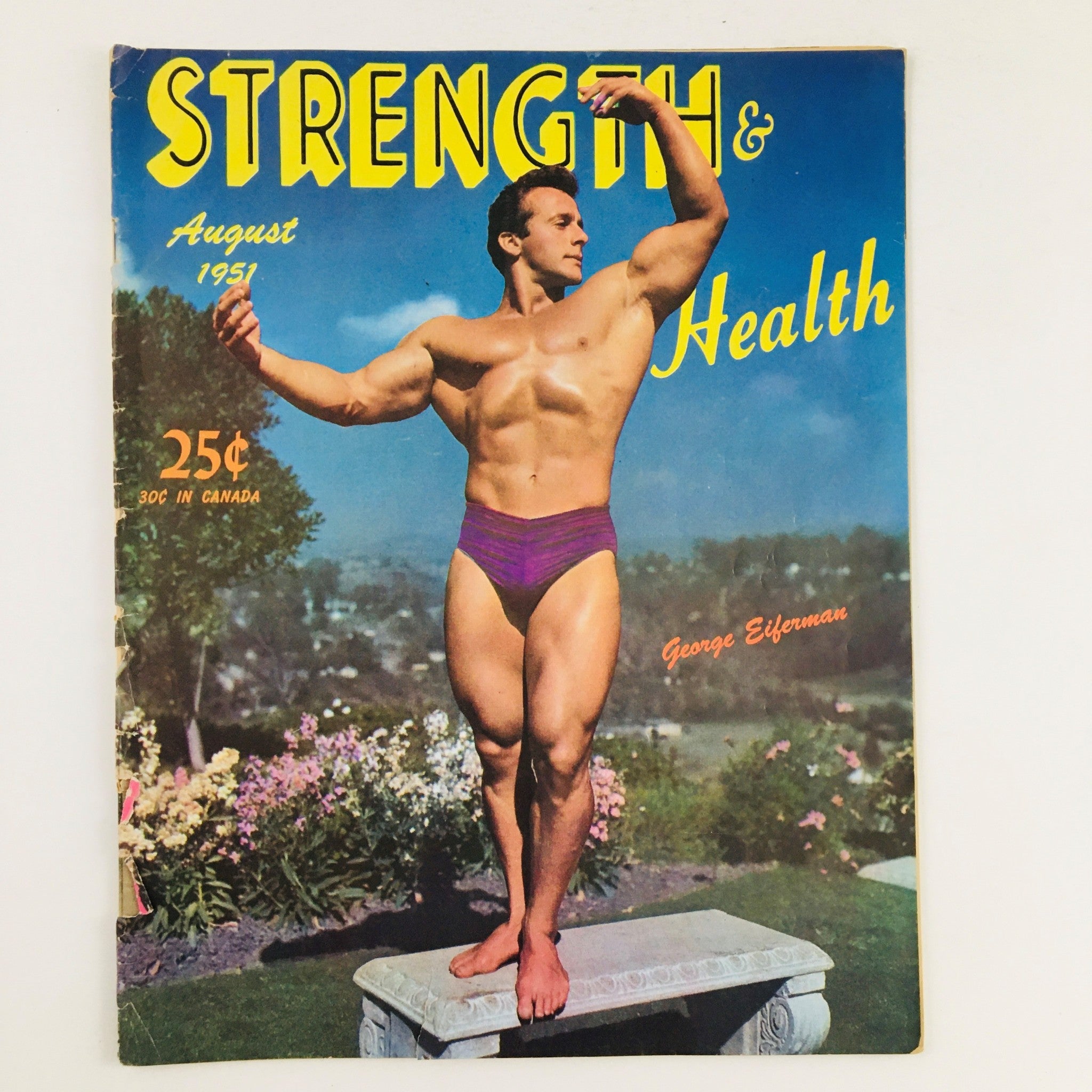 Cover of Strength & Health Magazine August 1951 featuring George Eiferman, an iconic bodybuilder posing outdoors, showcasing vintage bodybuilding culture.