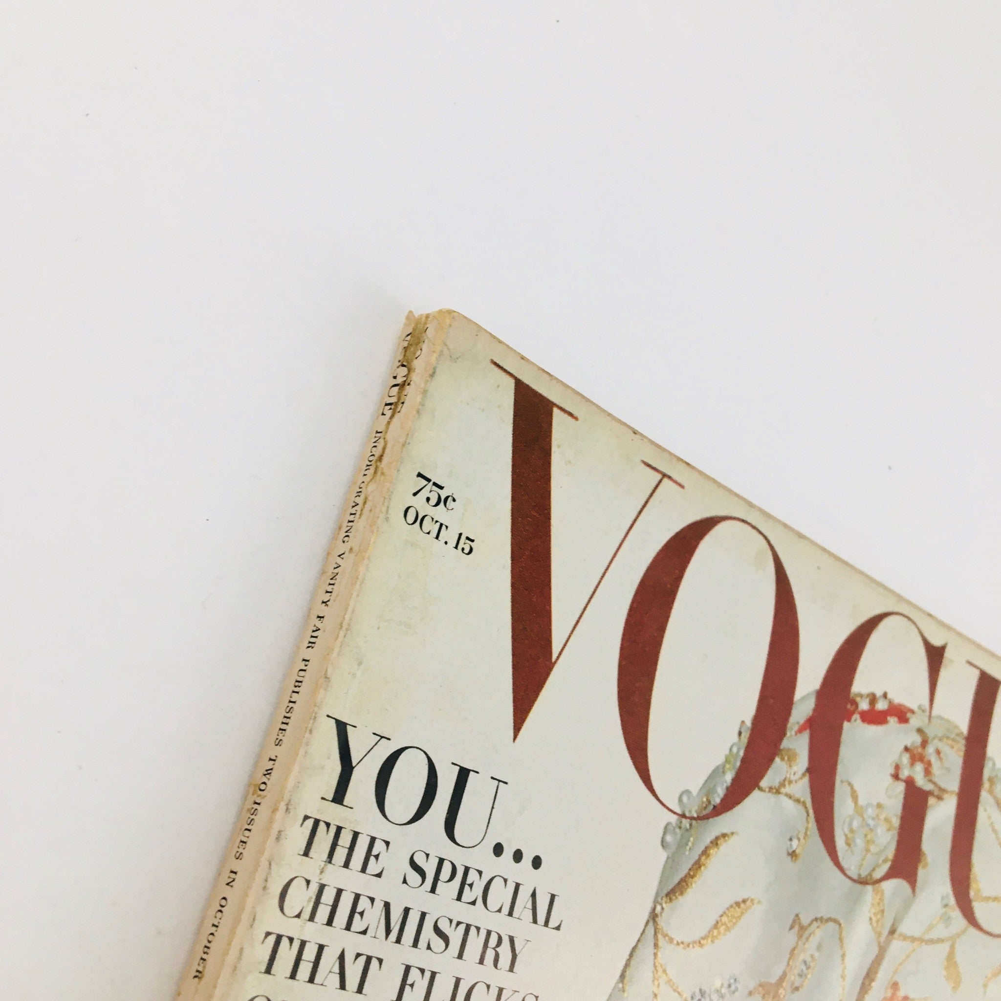 Spine view of VTG Vogue Magazine from October 15, 1964 displaying the title 'You... The Special Chemistry that Flicks on Fashion'.