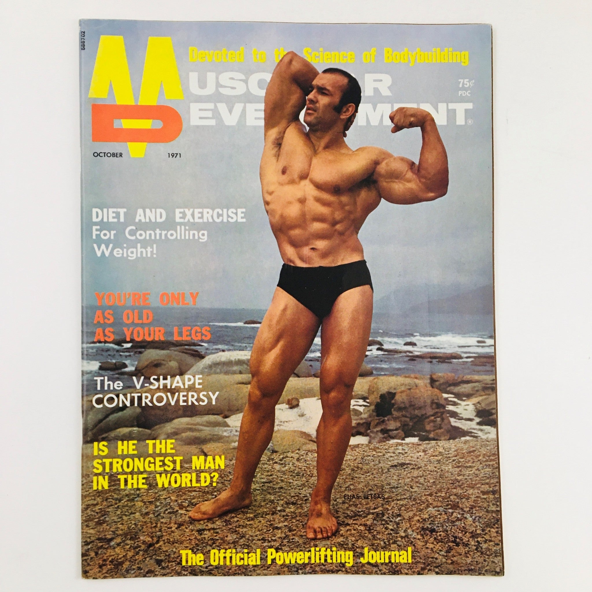 Muscular Development Magazine October 1971 featuring bodybuilder Elias Petsas on the cover in a classic bodybuilding pose against a coastal background.