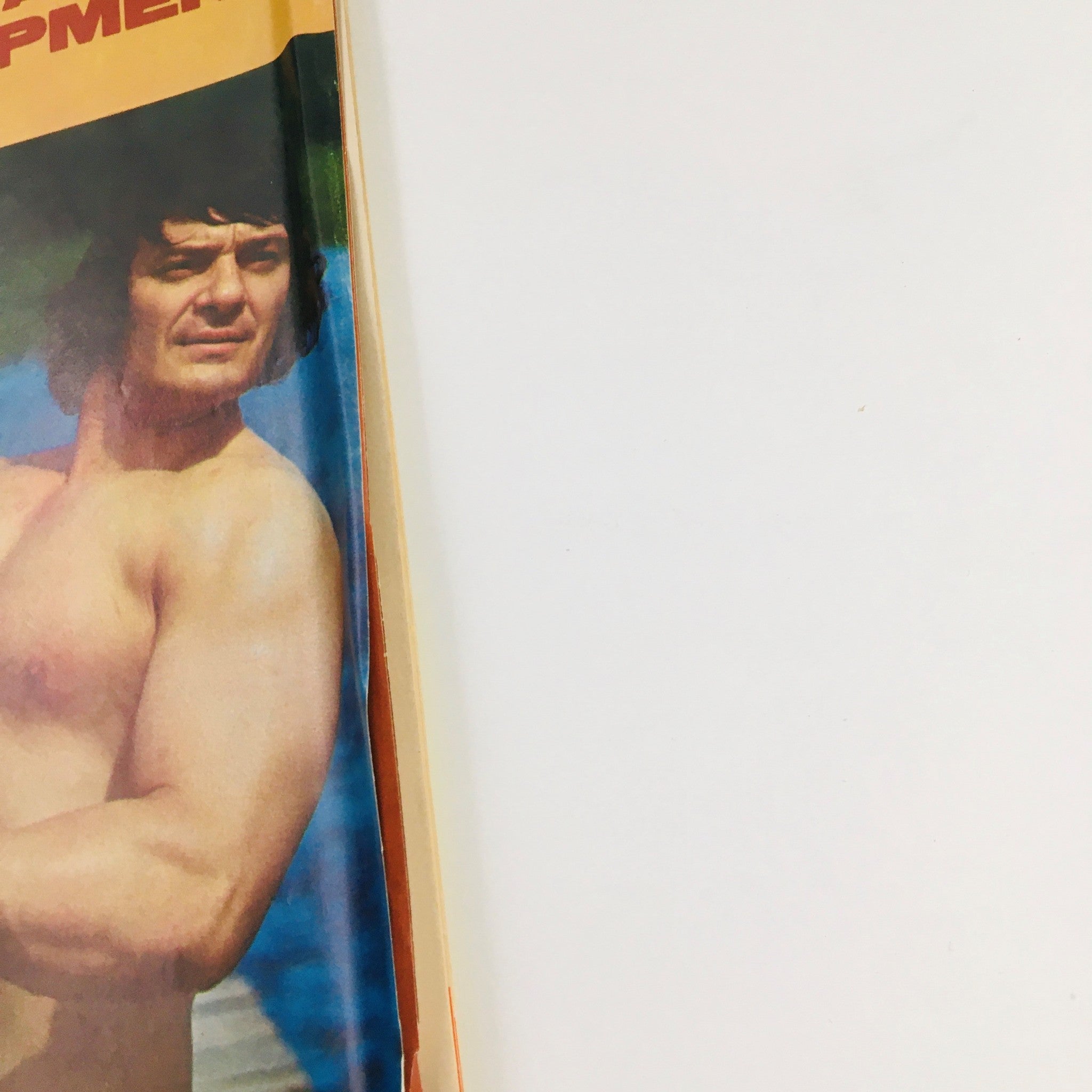 Close-up view of the cover of Muscular Development Magazine January 1972, featuring Gino San Rocco with text discussing aging muscles and fitness advice.