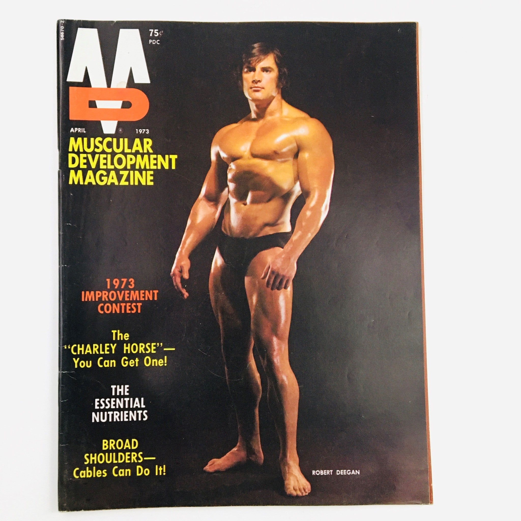 Cover of Muscular Development Magazine April 1973 featuring Robert Deegan, showcasing the bodybuilding industry of the 1970s.
