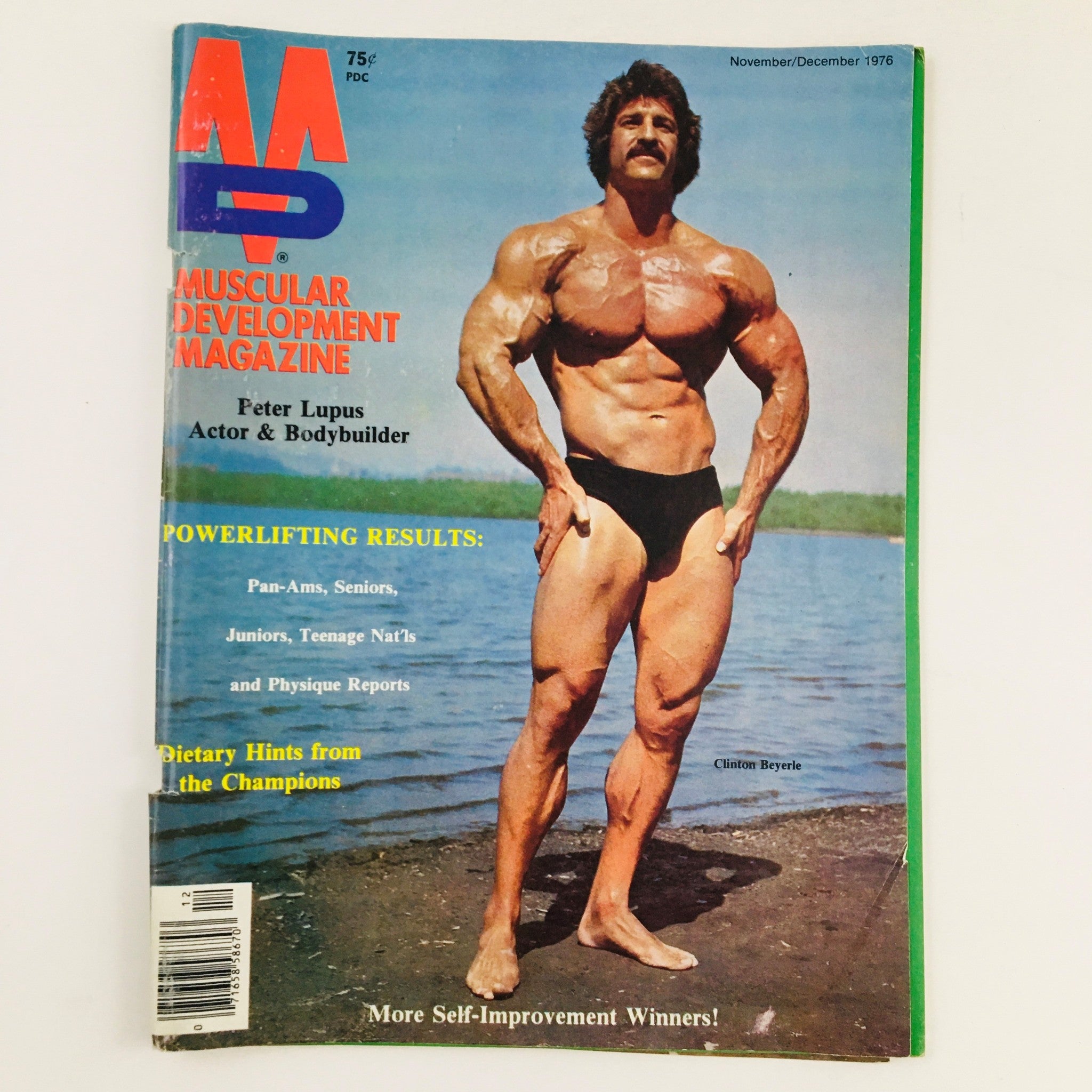 Cover of Muscular Development Magazine November 1976 featuring Peter Lupus as the main subject, showcasing bodybuilding culture.
