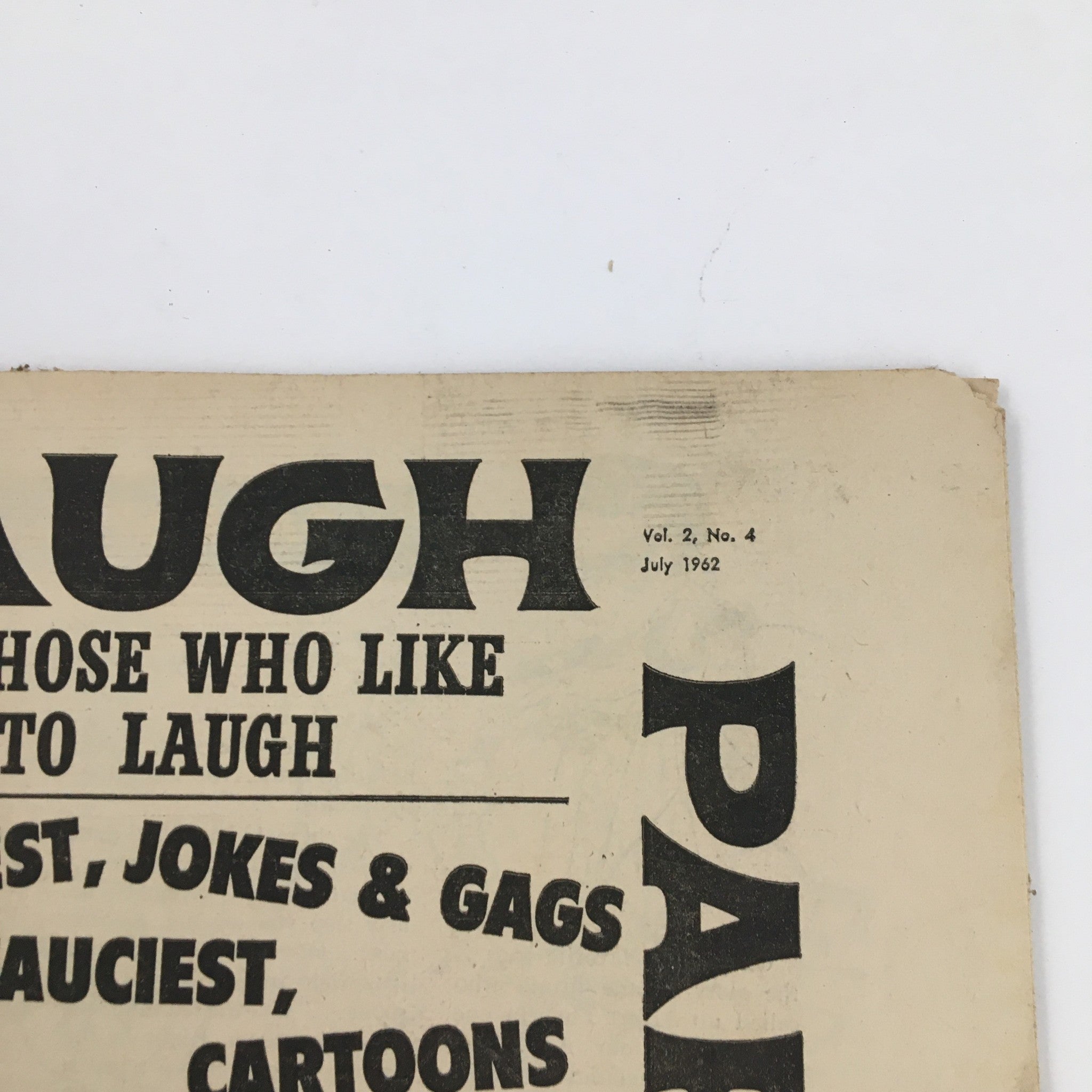Top section of the Laugh Parade Humor Magazine July 1962 showing volume and issue number, highlighting its vintage design.