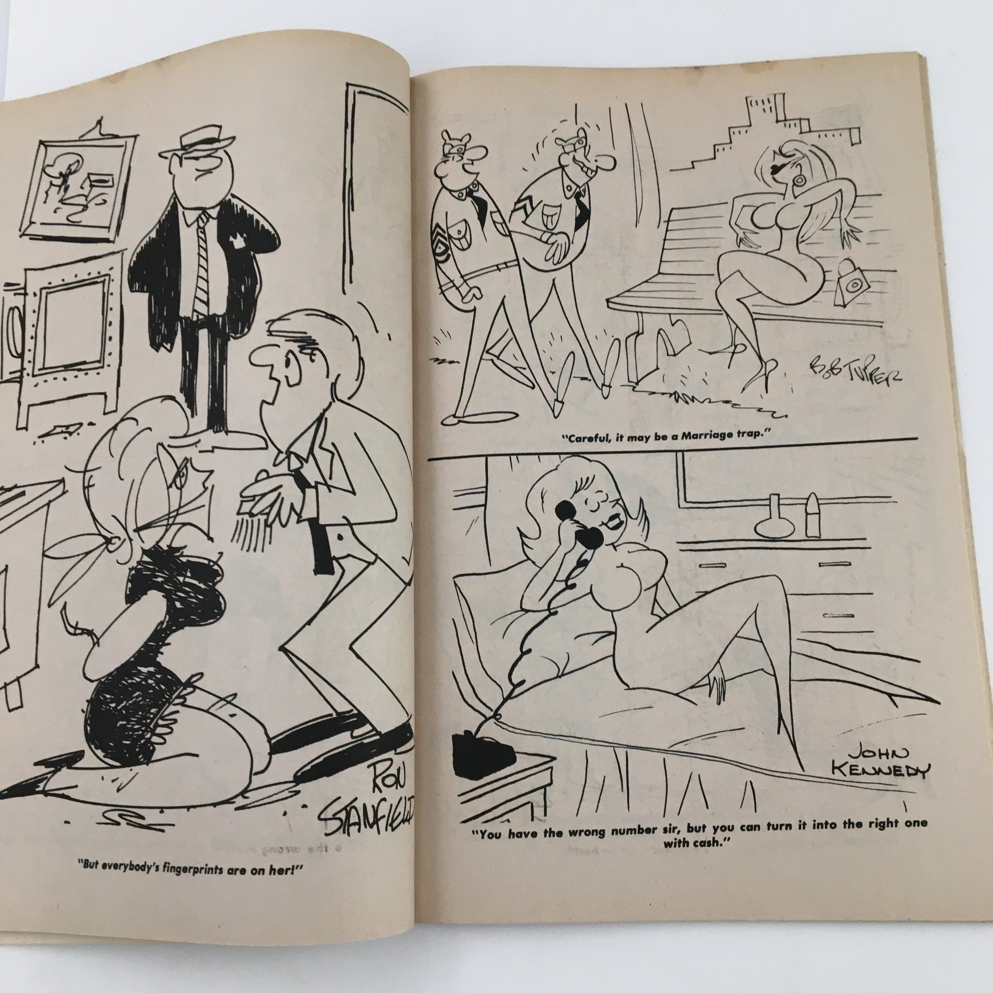 Cartoon illustrations from VTG 150 New Cartoons October 1971 No. 42 Charlton Joke Magazine, depicting funny situations and characters in whimsical artwork.