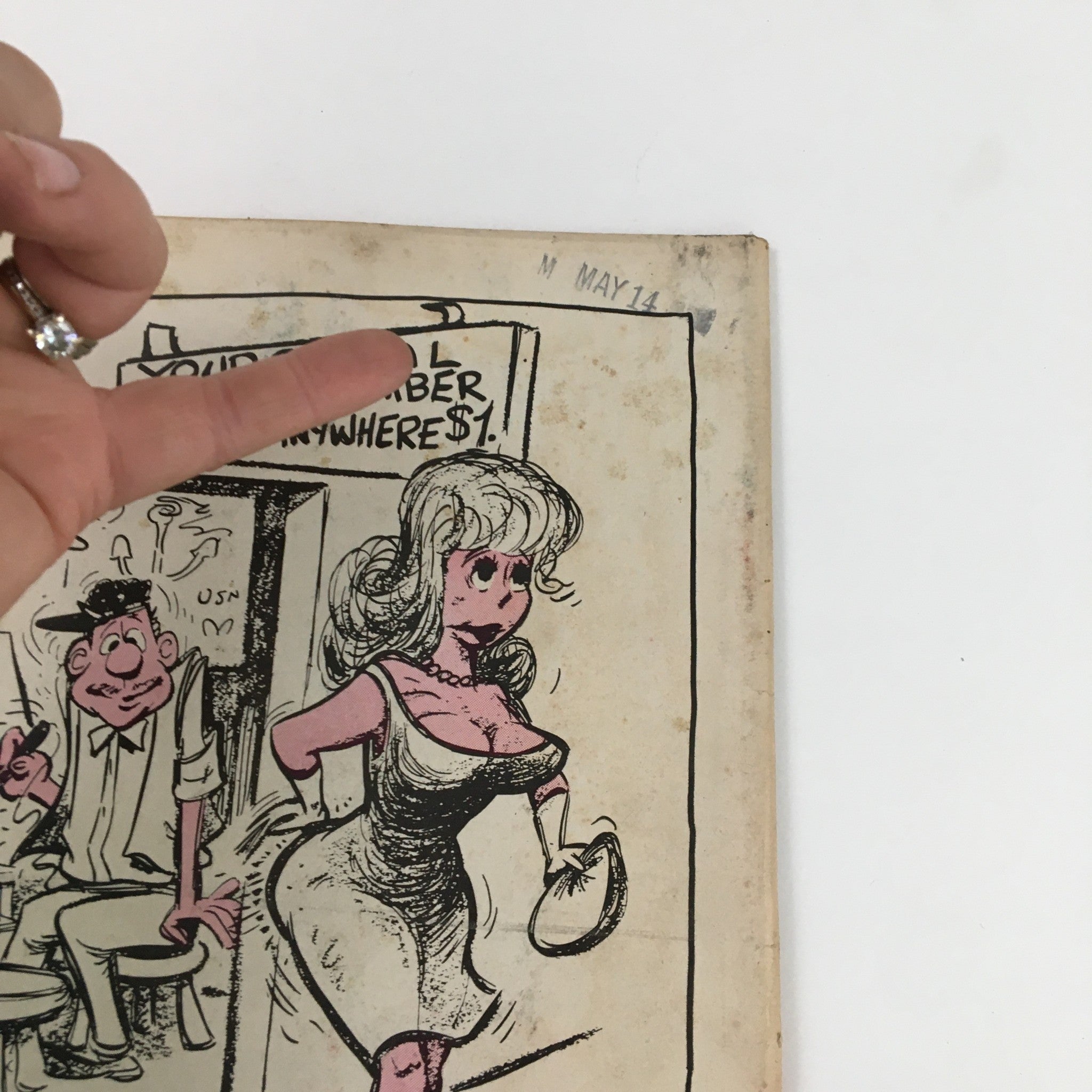 Close-up of the humorous cover illustration from 'French Cartoons and Cuties' August 1964, Vol. 1 No. 37, showing a woman with a handbag and a man sitting in the background, with an emphasis on the sign about tattooing social security numbers.