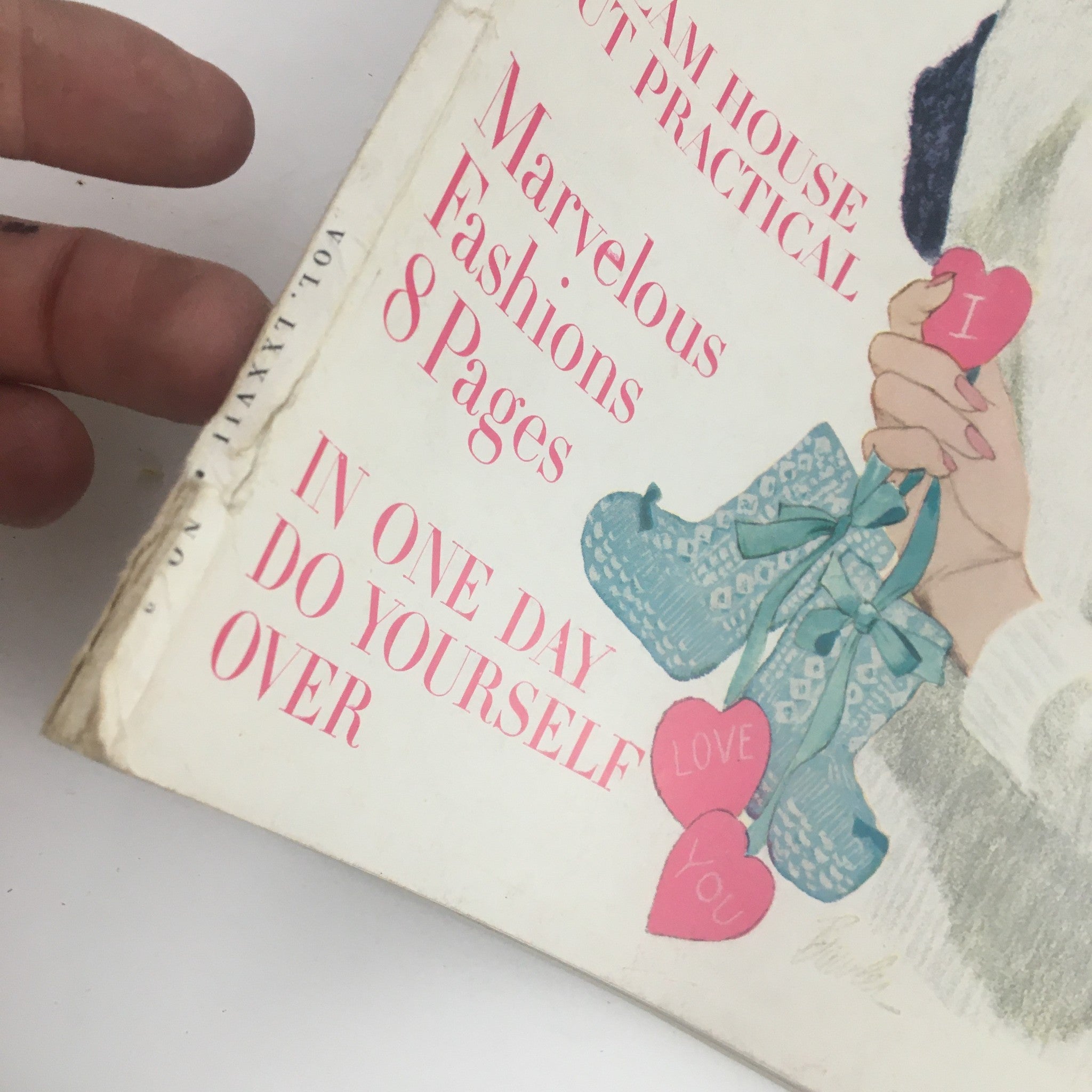 Close-up of the cover text from the February 1960 Ladies' Home Journal Magazine titled 'If I Had To Do It Over Again', highlighting articles about fashions and practical home tips with colorful hearts and decorations.