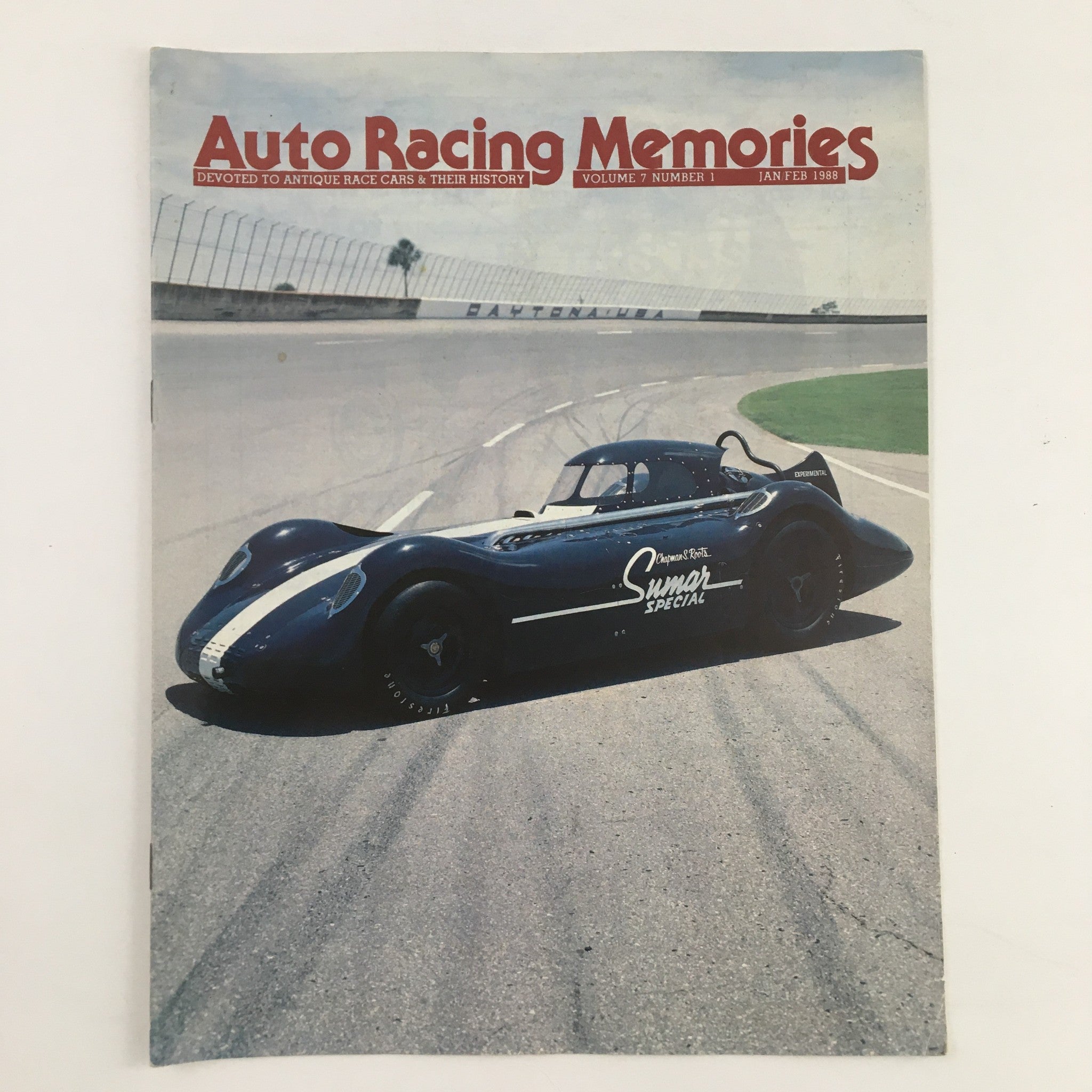 Cover of 'Auto Racing Memories' January 1988 featuring a blue race car on a racetrack, highlighting the magazine's focus on antique race cars and their history.