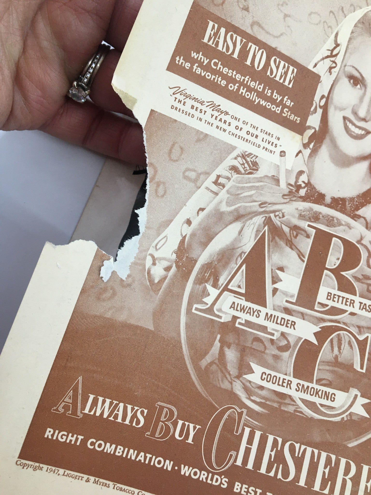 Torn edge of a vintage advertisement from the 1947 Center Theatre program featuring Skippy Baxter and Paul Castle in Icetime.
