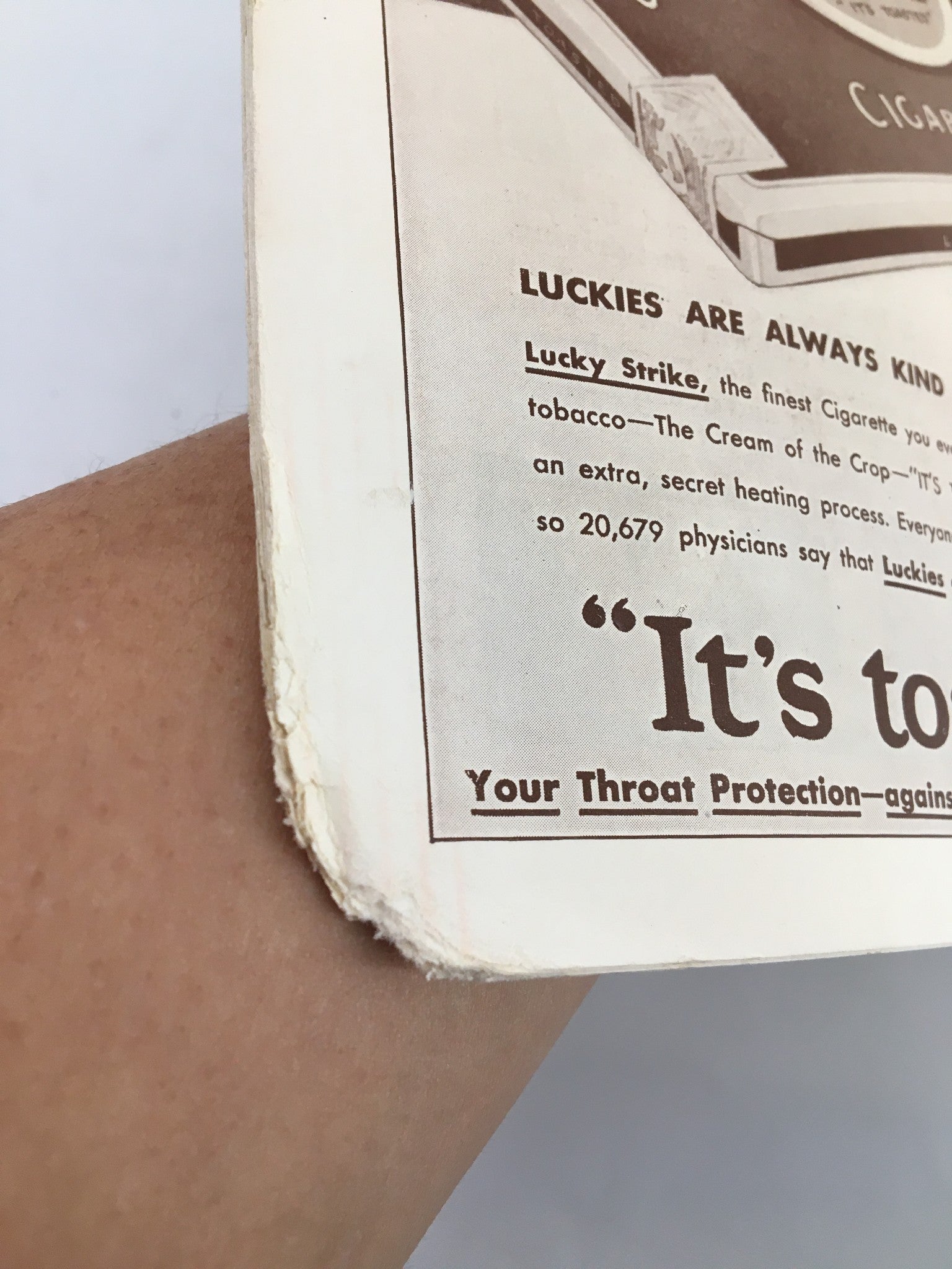 Back cover of the 1930 Biltmore Theatre magazine showcasing a vintage advertisement for Lucky Strike cigarettes, highlighting throat protection benefits.