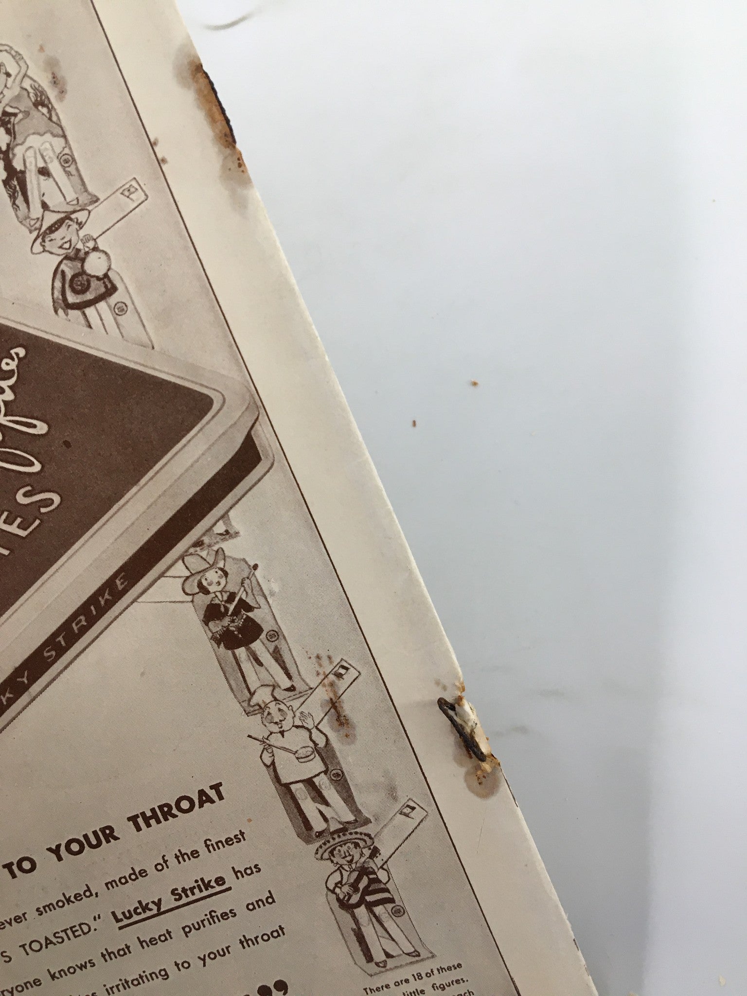Inside of the 1930 Biltmore Theatre magazine featuring a vintage advertisement for Lucky Strike cigarettes, illustrating the product's appeal with illustrations and claims.