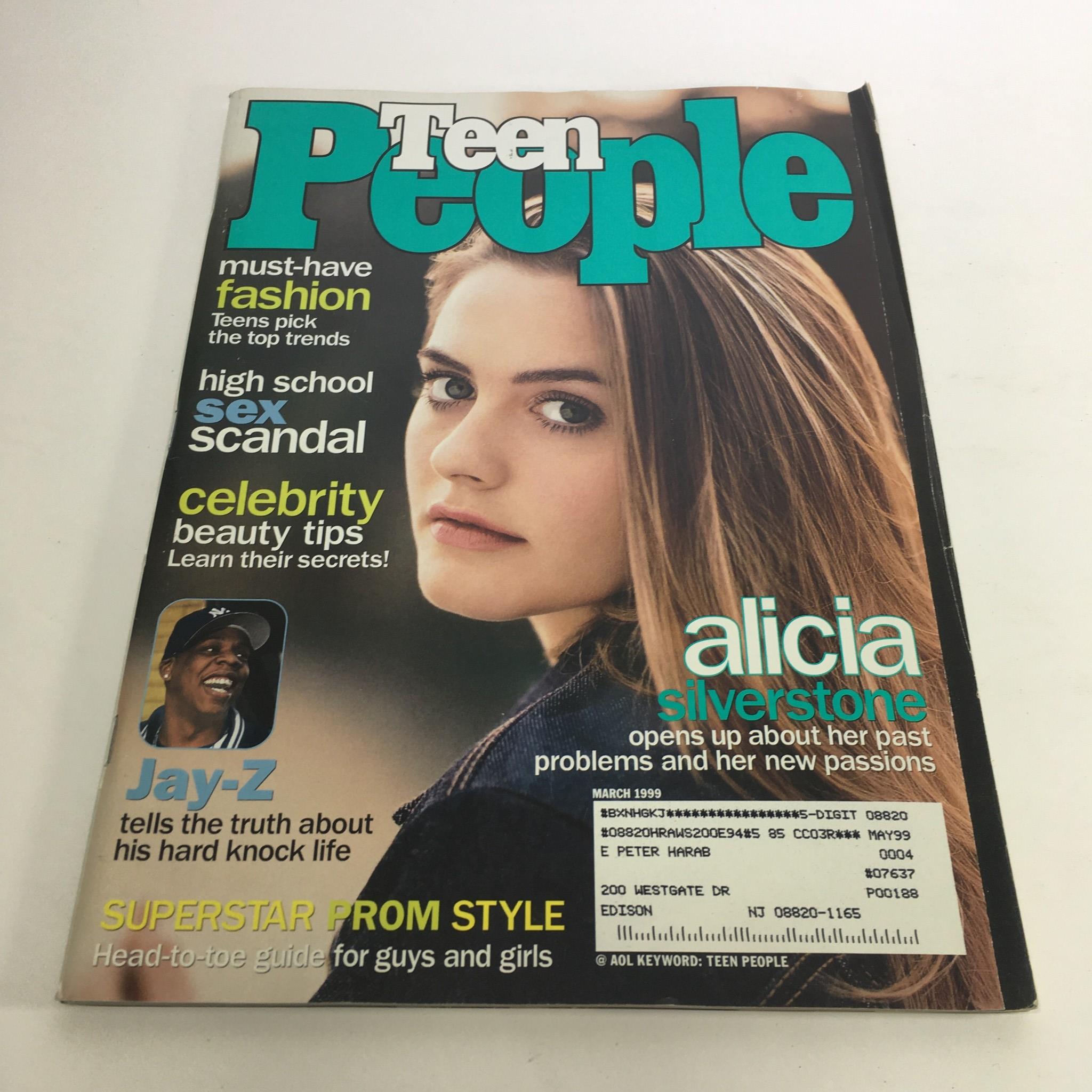 Cover of People Magazine from March 1999 featuring Alicia Silverstone discussing her past and Jay-Z sharing his truth. The magazine includes headlines on must-have fashion, high school scandals, and celebrity beauty tips.
