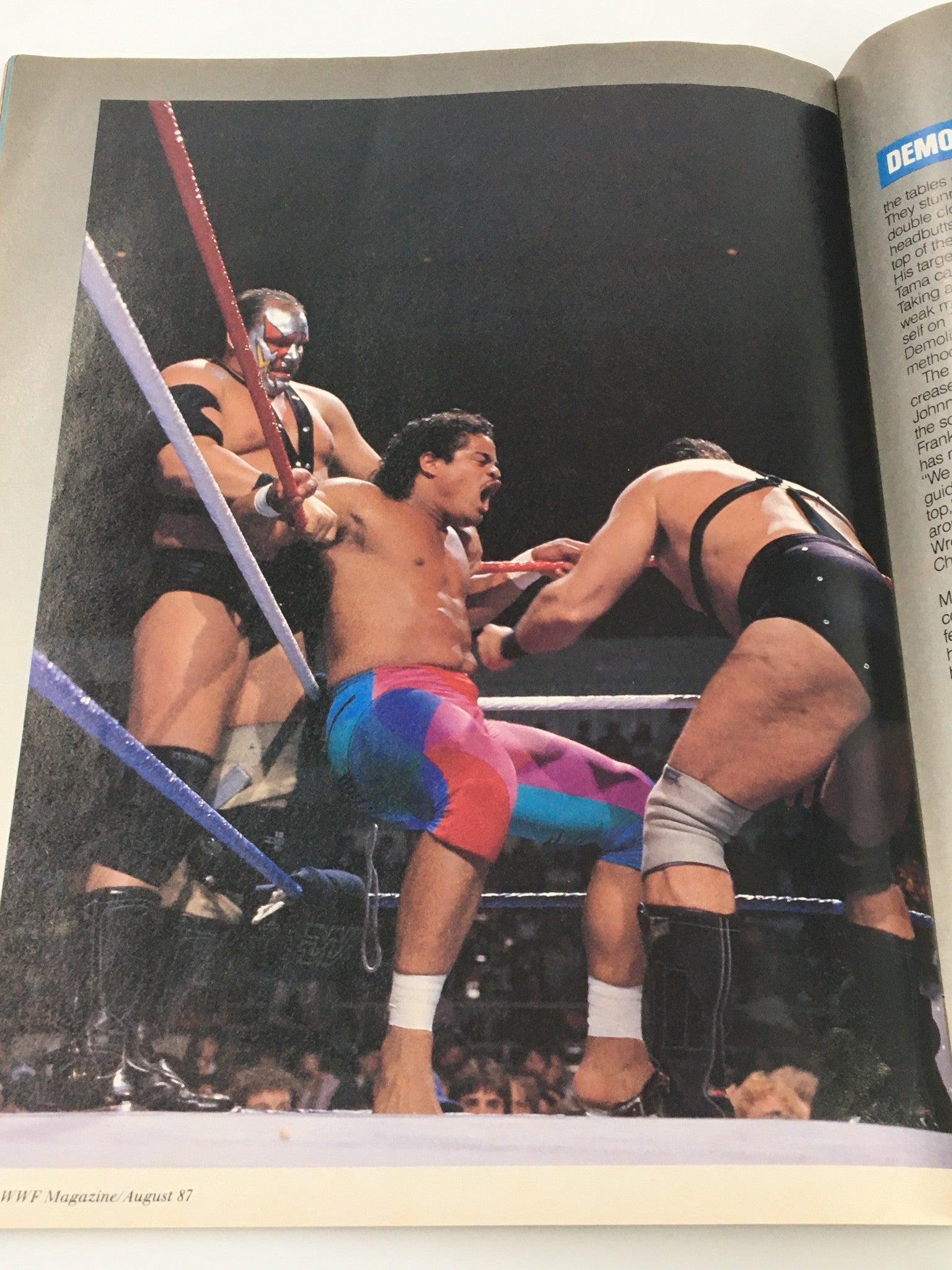 WWF Magazine August 1987 depicting a wrestling scene with an intense match involving two wrestlers, highlighting the dramatic dynamics of professional wrestling.