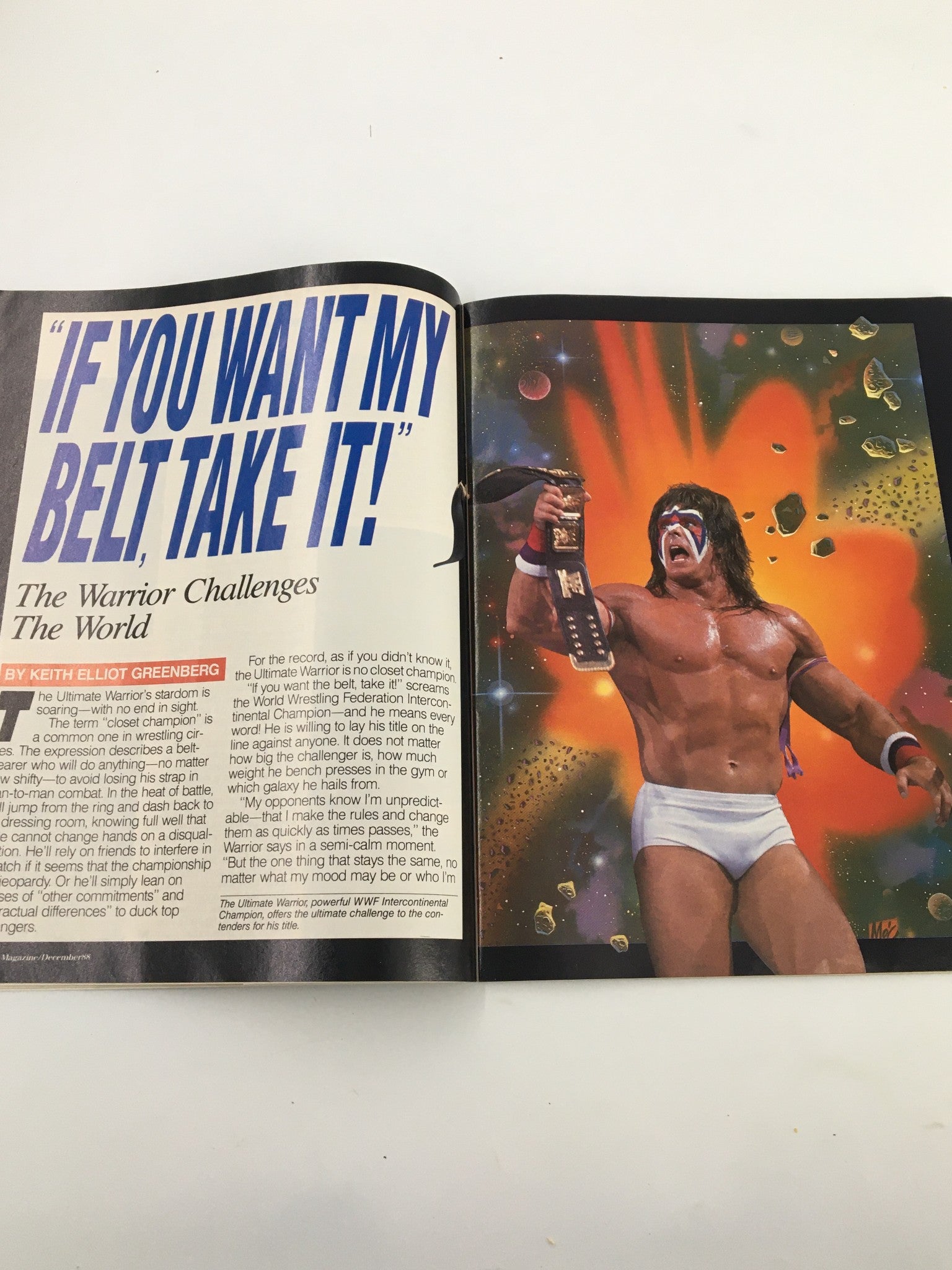 Colorful page from VTG WWF Magazine December 1988 featuring the Ultimate Warrior with the belt, challenging contenders in a dynamic illustration.