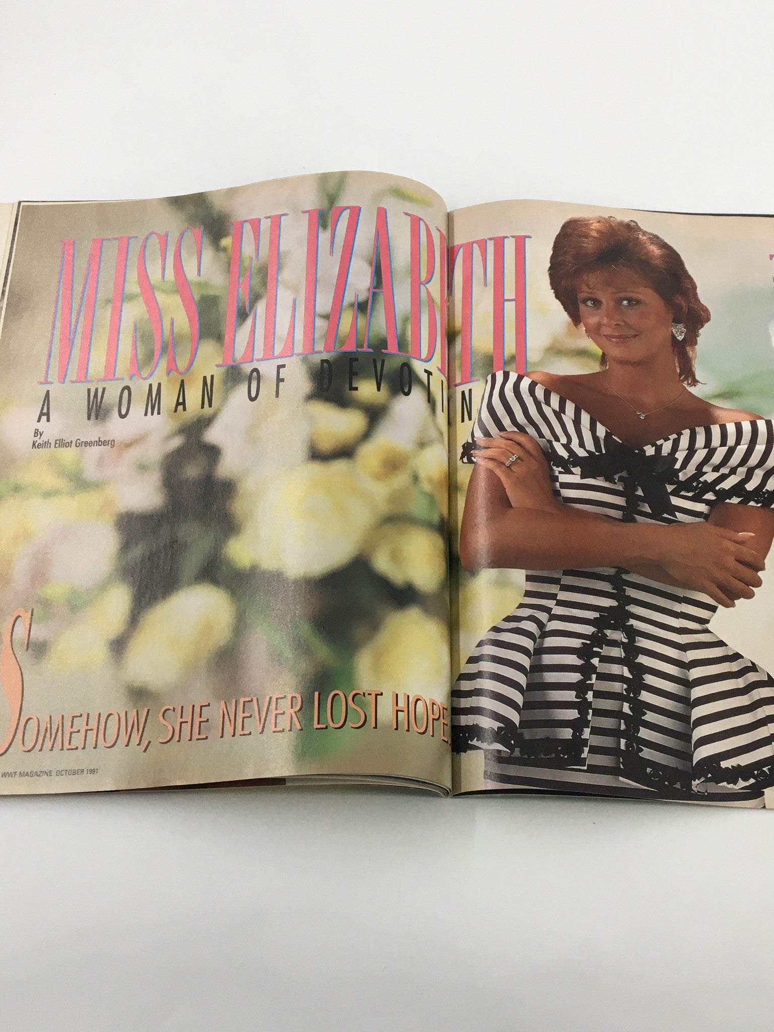 Profile on Miss Elizabeth in WWF Magazine October 1991, portraying her as a devoted figure in wrestling history, adorned in elegant attire.