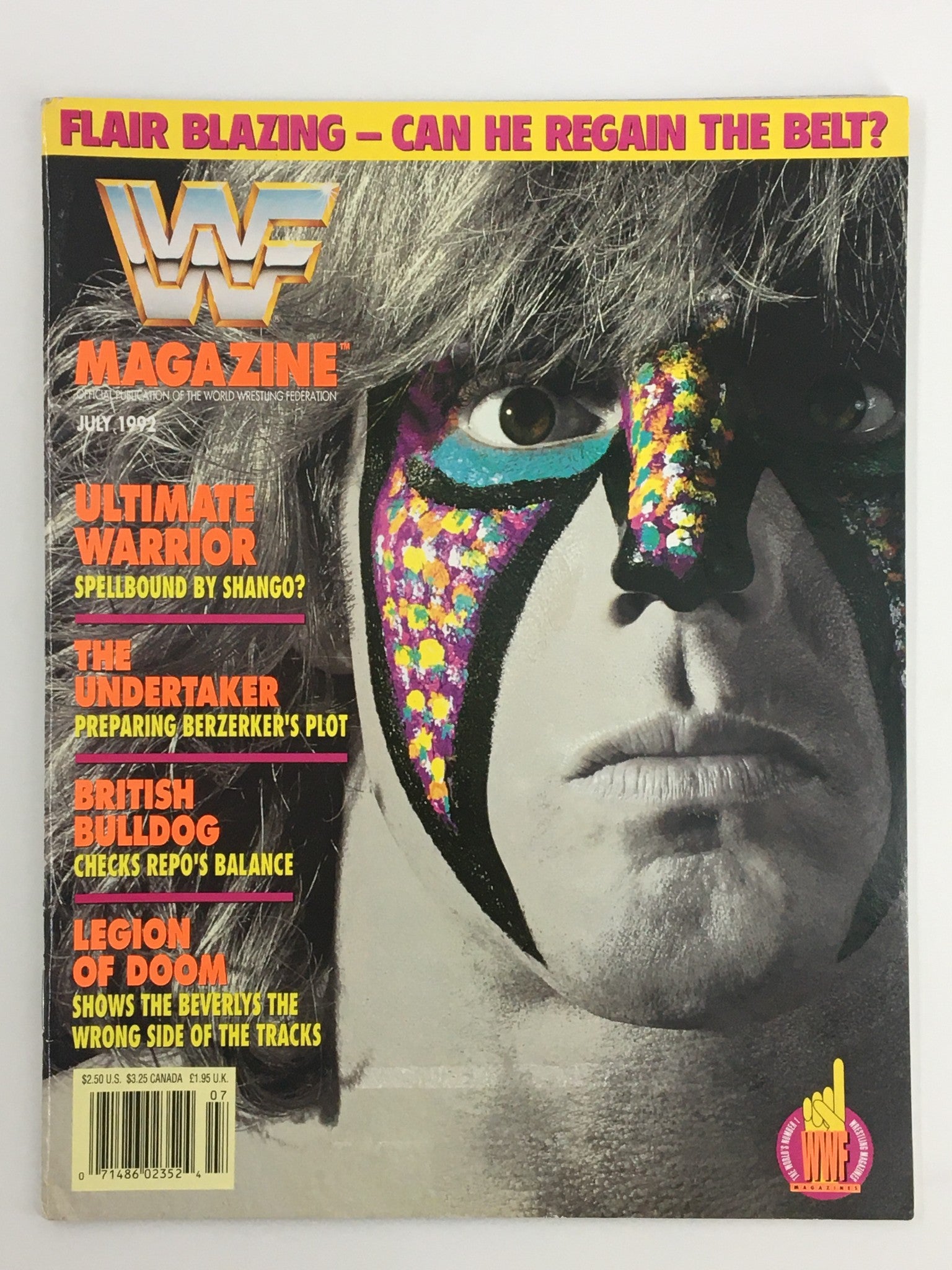 Cover of VTG WWF Magazine July 1992 featuring Ultimate Warrior, The Undertaker, and British Bulldog with colorful graphics and the headline "Flair Blazing - Can He Regain The Belt?"