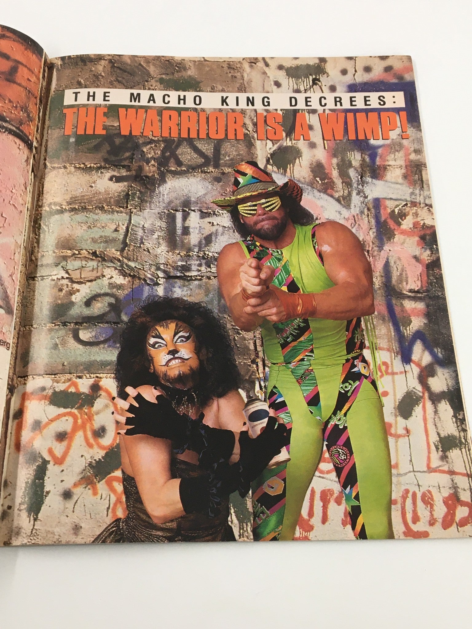 WWF Magazine January 1991 - Cover image of The Macho King and another wrestler, featuring bold lettering proclaiming 'The Warrior is a Wimp!'.