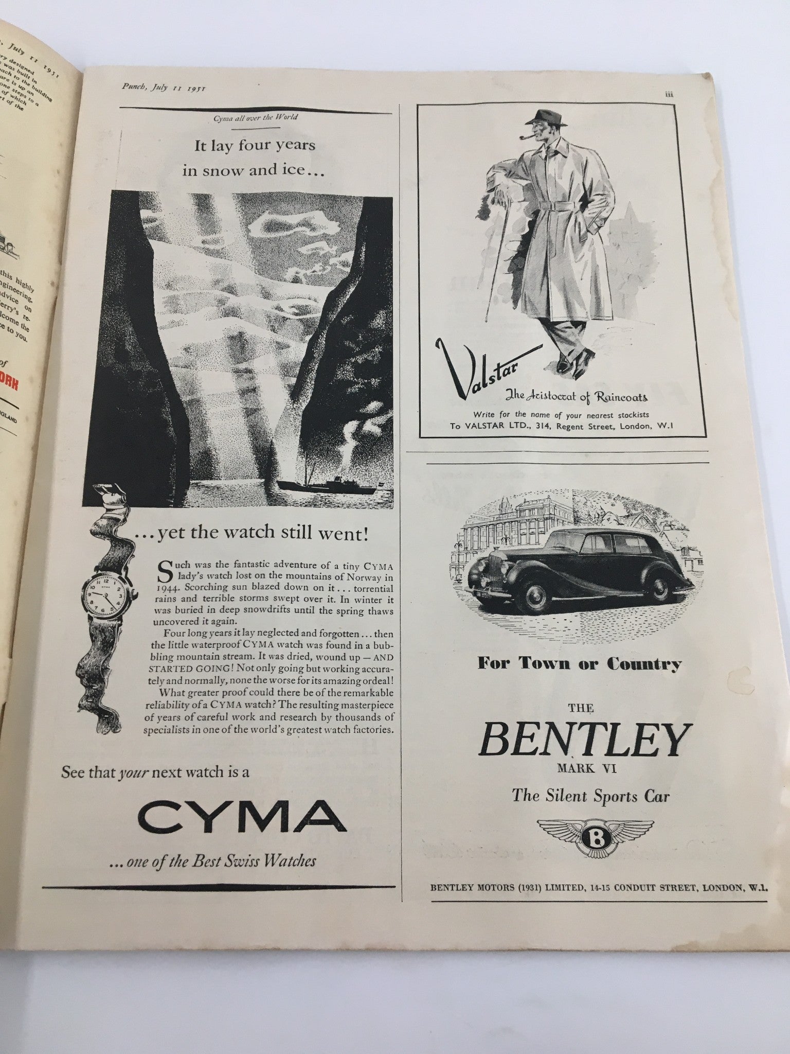 Vintage Punch magazine page from July 11, 1951, showcasing an advertisement for CYMA watches. The advertisement highlights the reliability and history of CYMA watches, alongside classic promotional illustrations, complementing the WWII-era humor and political commentary featured in the magazine.