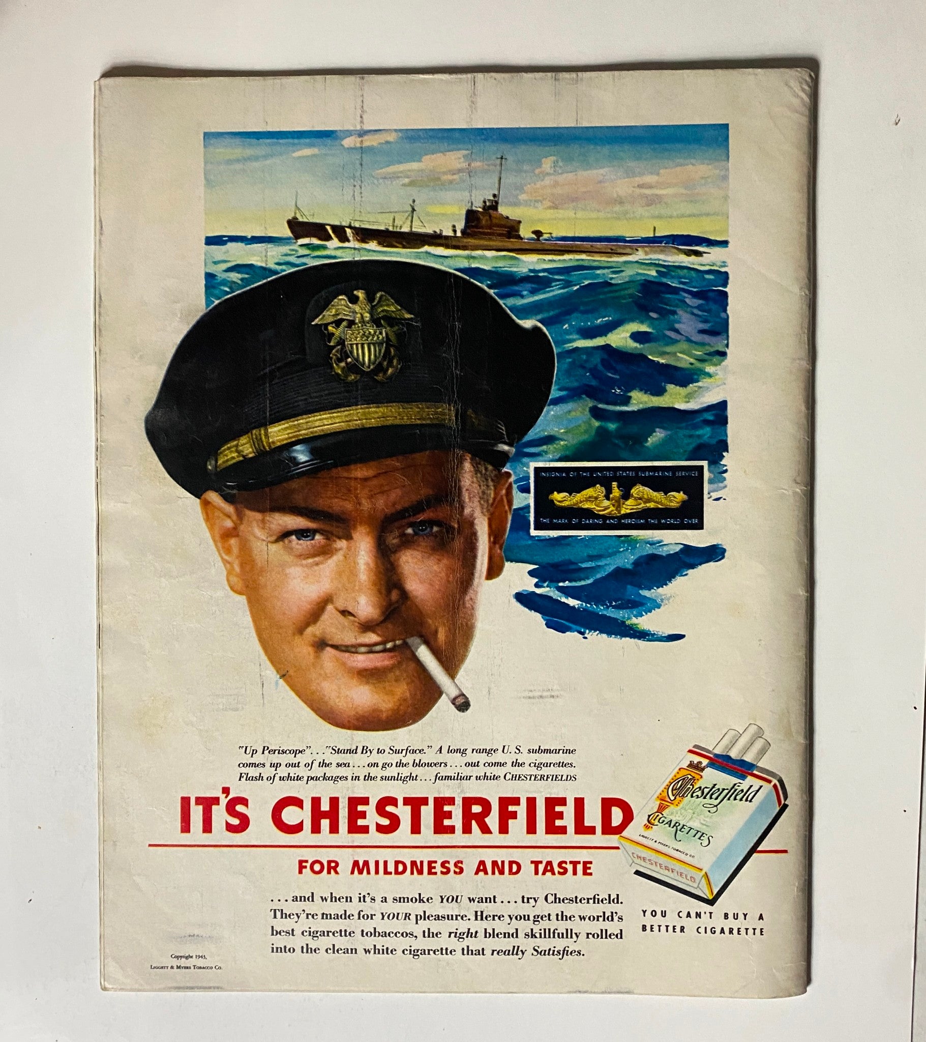 Advertisement page from VTG Look Magazine, September 7, 1943, Vol 7 No. 18 featuring a naval officer promoting Chesterfield cigarettes.
