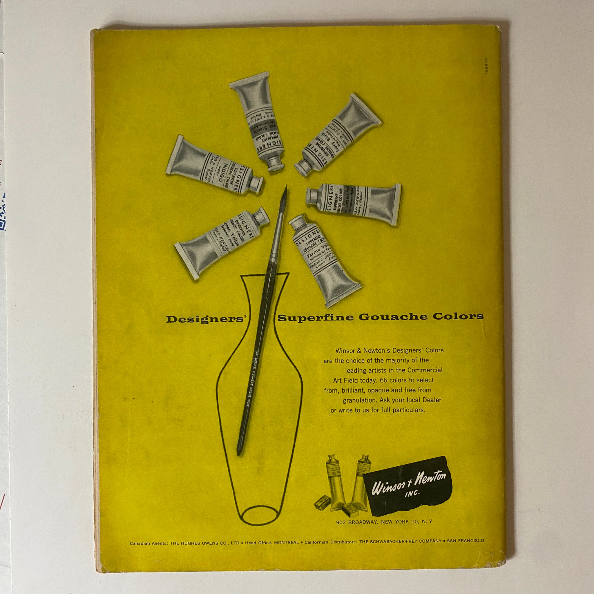 Vintage advertisement featuring Winsor & Newton's Designers' Superfine Gouache Colors on the back cover of the April 1956 issue of VTG Art News Magazine. The image displays a vibrant yellow background with tubes of gouache paint arranged in a circular pattern around a paintbrush and vase, highlighting the art supplies relevant to artists.