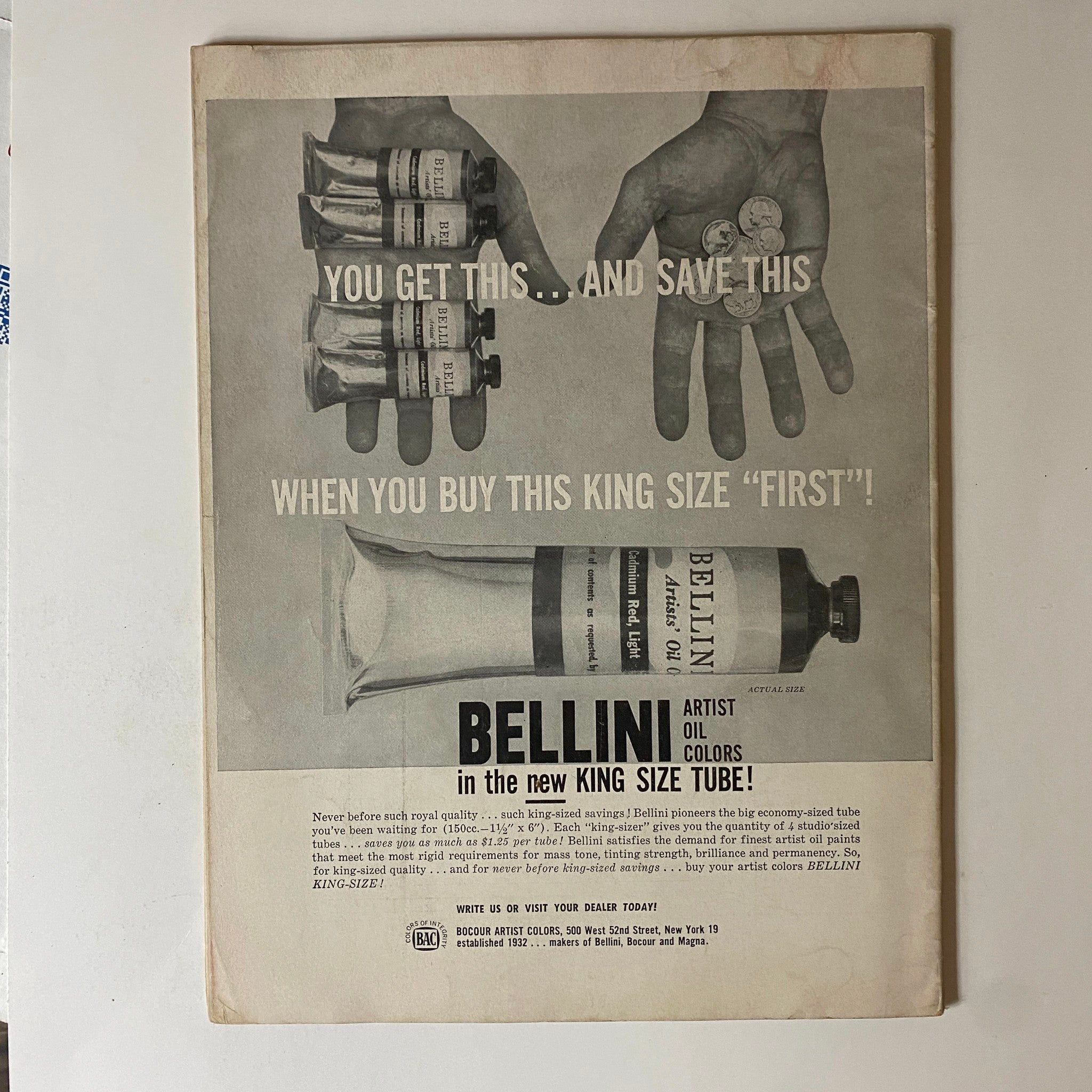 Advertisement from VTG Art News Magazine April 1958 promoting Bellini artist oil colors in a king size tube. The image contrasts hands holding paint tubes and coins, emphasizing value for artists.