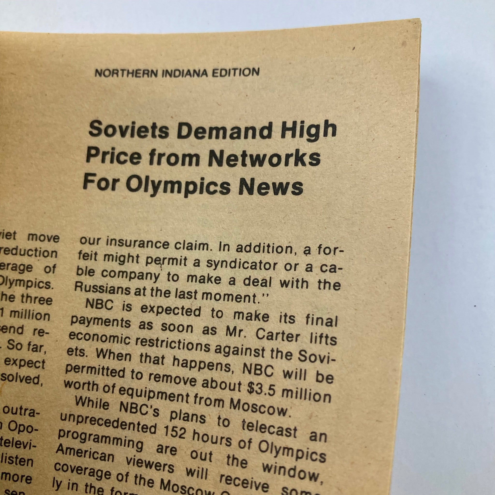 Close-up view of a page from TV Guide Magazine July 5 1980 featuring an article titled 'Soviets Demand High Price from Networks For Olympics News' from the Northern Indiana Edition.