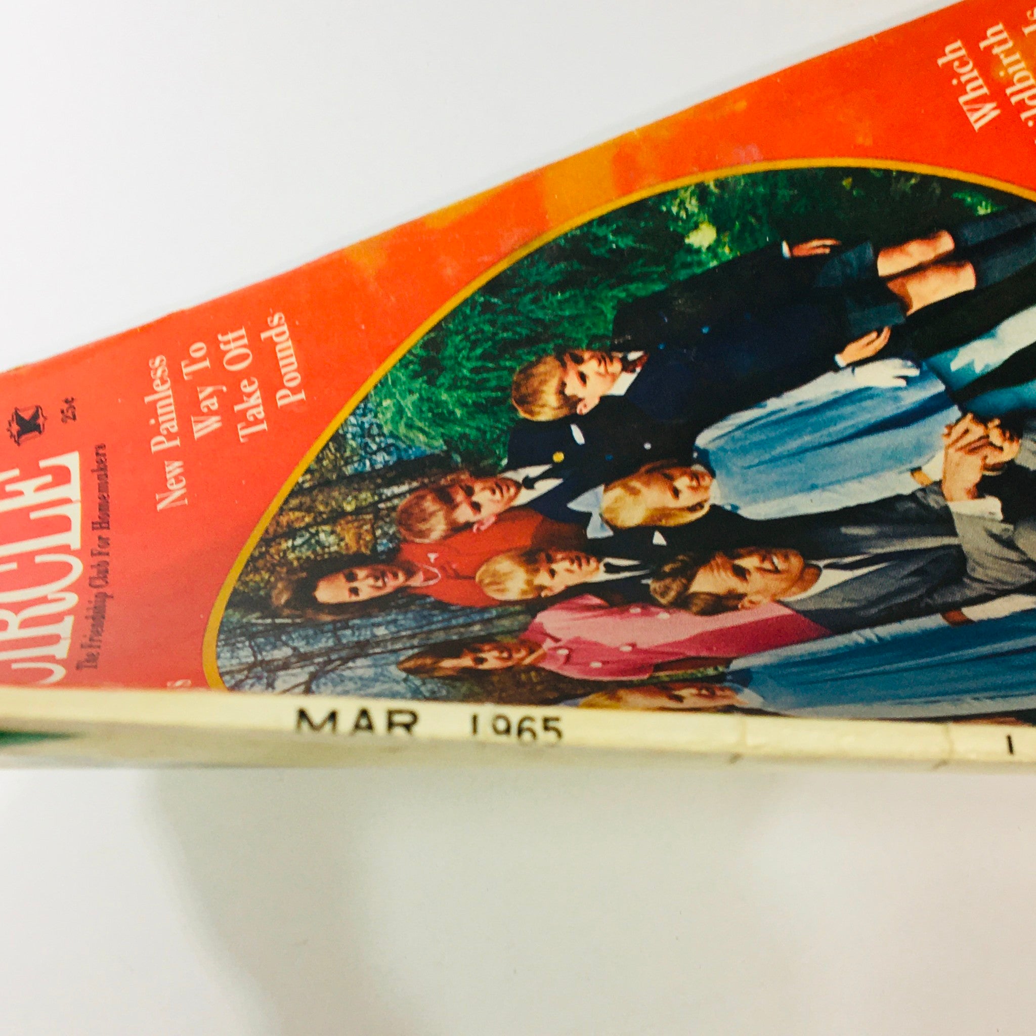 Side view of the March 1965 Lady's Circle magazine showing the date and vintage condition of the publication.