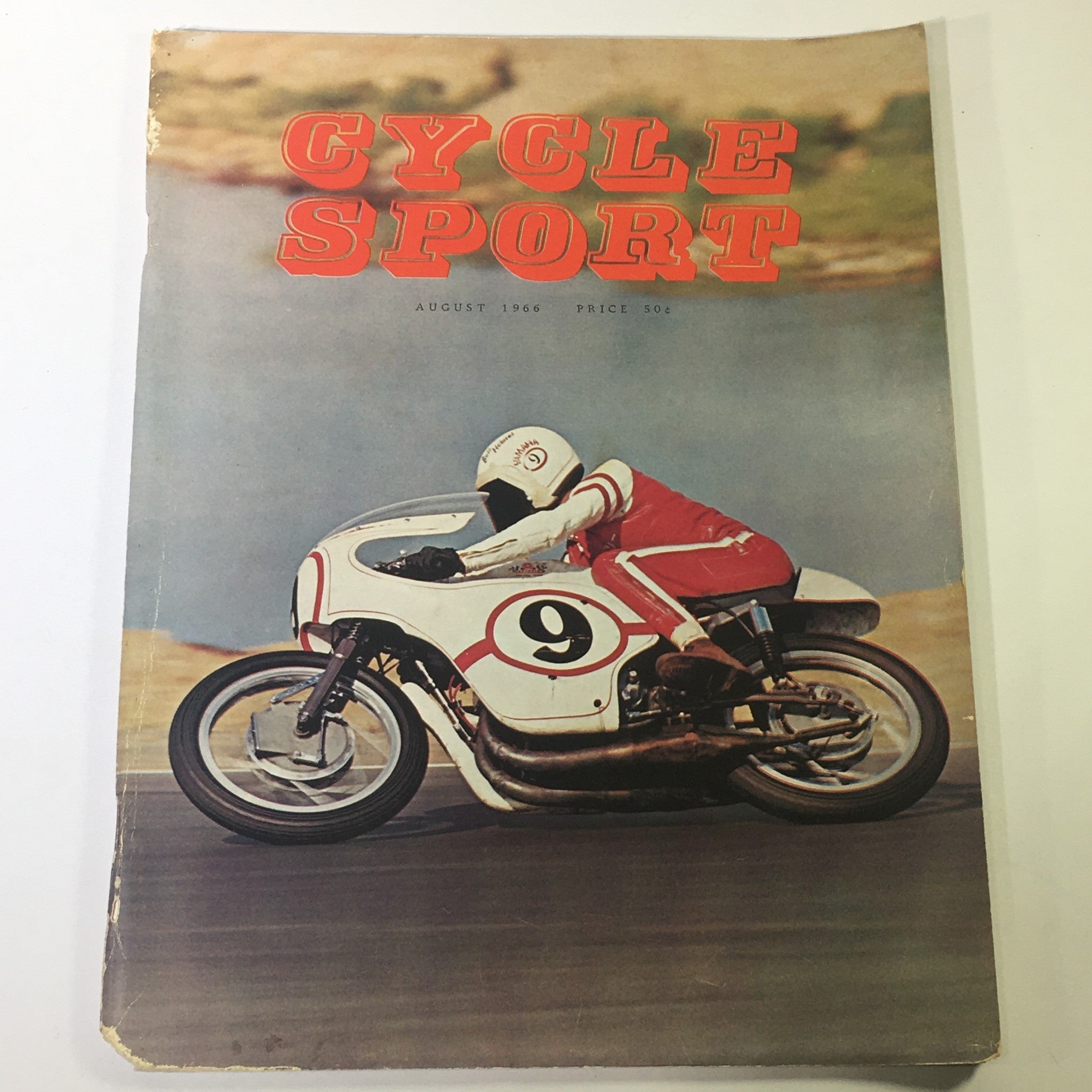 Cover of VTG Cycle Sport Magazine August 1966 showcasing a motorcycle racer on the track. The magazine features bold headlines and a vibrant image, appealing to motorcycle enthusiasts.