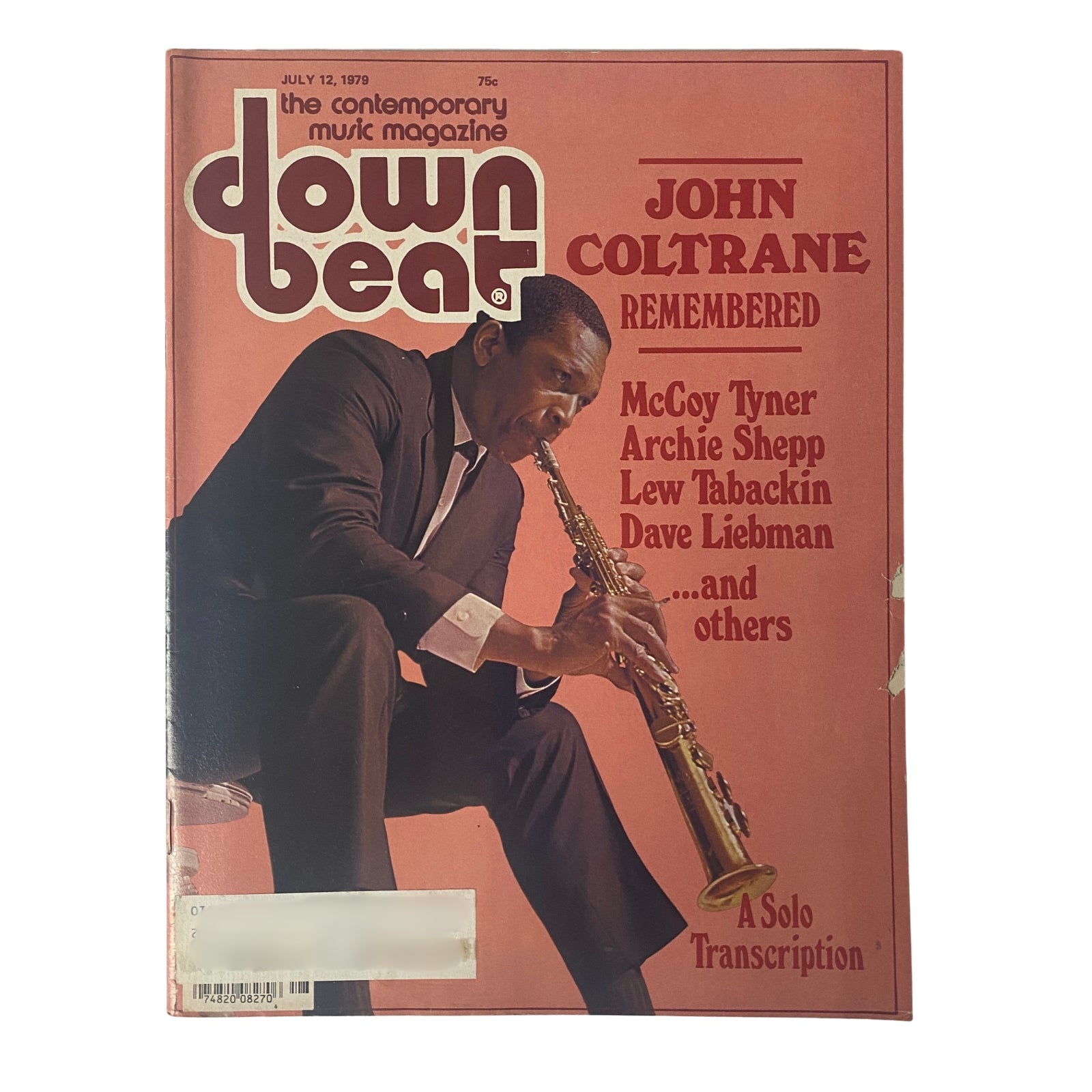Cover of Down Beat Magazine, July 12, 1979, Vol 46 No. 13, featuring John Coltrane remembered, with McCoy Tyner and others. The magazine highlights Coltrane's musical legacy and includes a solo transcription.