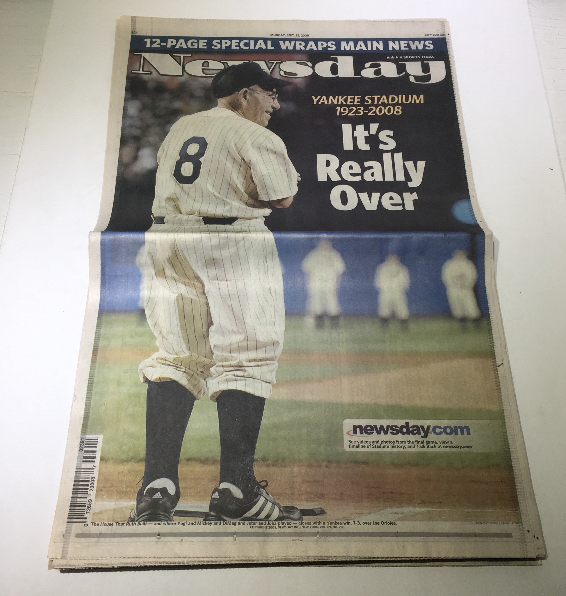 Front page of Newsday featuring the title 'Newsday: Sept 22 2008 Yankee Stadium 1923-2008 It's Really Over', showcasing a player wearing number 8 standing on a baseball field.