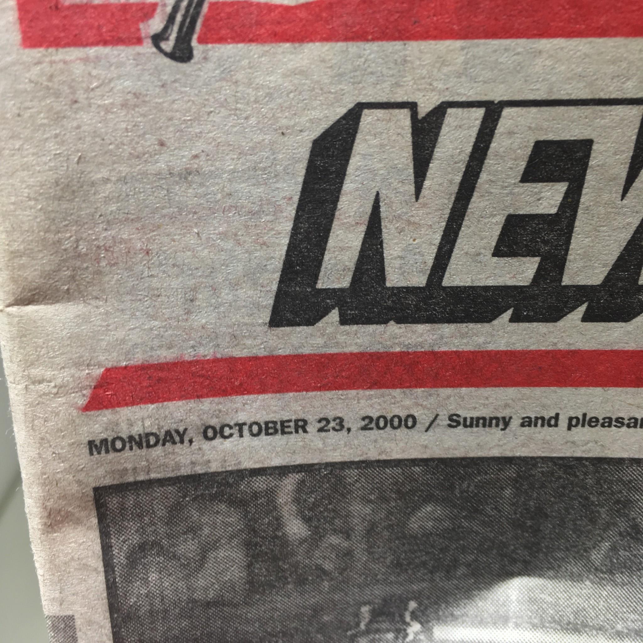 Close-up of the New York Post date from October 23, 2000, representing an iconic vintage magazine from the early 2000s.