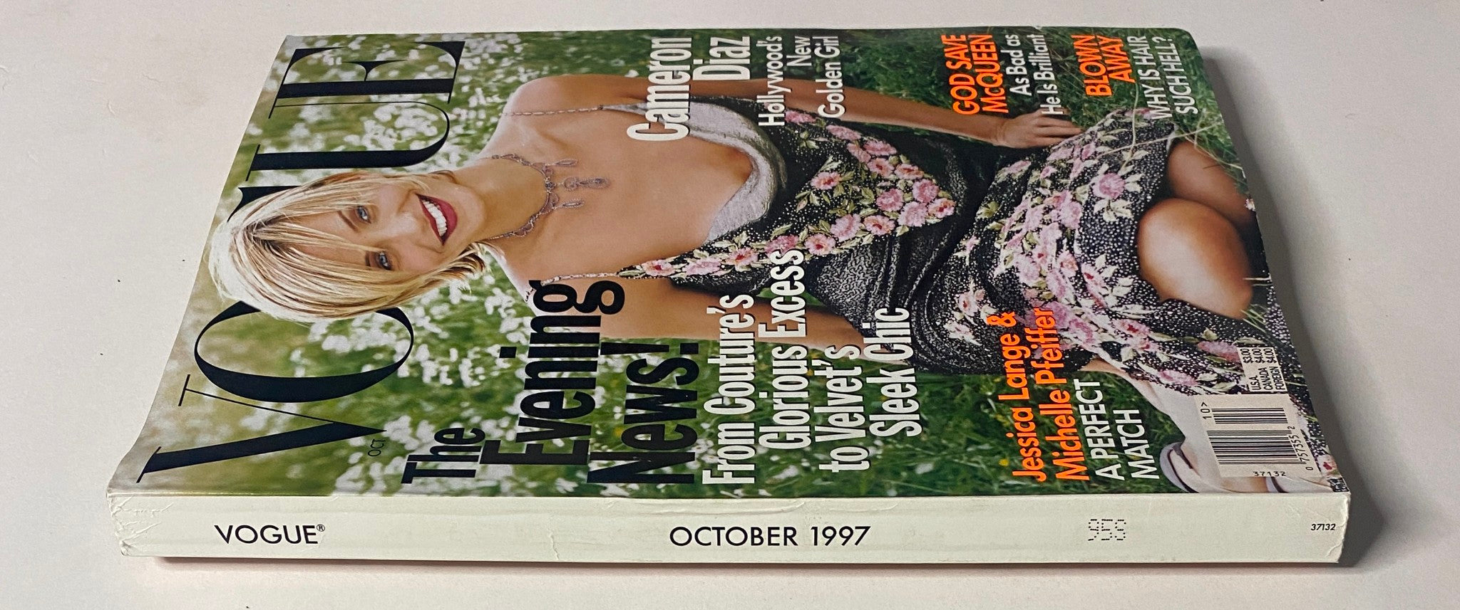 Side view of Vogue Magazine from October 1997 featuring Cameron Diaz on the cover. This vintage magazine explores fashion trends and includes articles on designer influences and celebrity features.