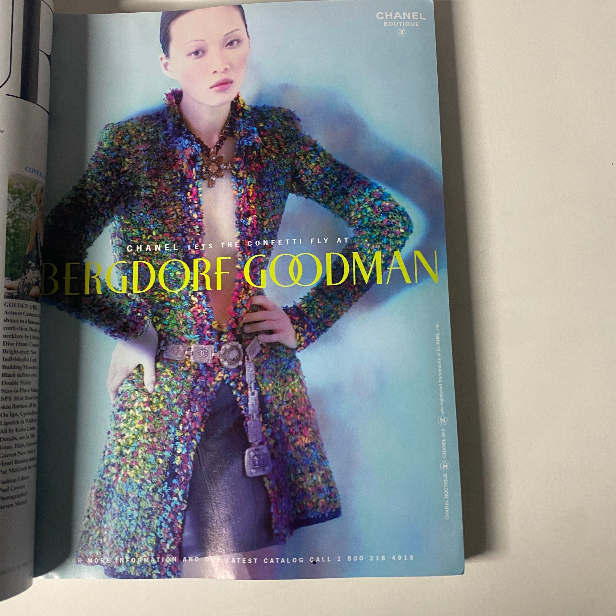 Vogue Magazine October 1997 displaying an advertisement for Bergdorf Goodman featuring a colorful Chanel coat design. The vibrant image emphasizes luxury fashion and beauty trends of the late 1990s.