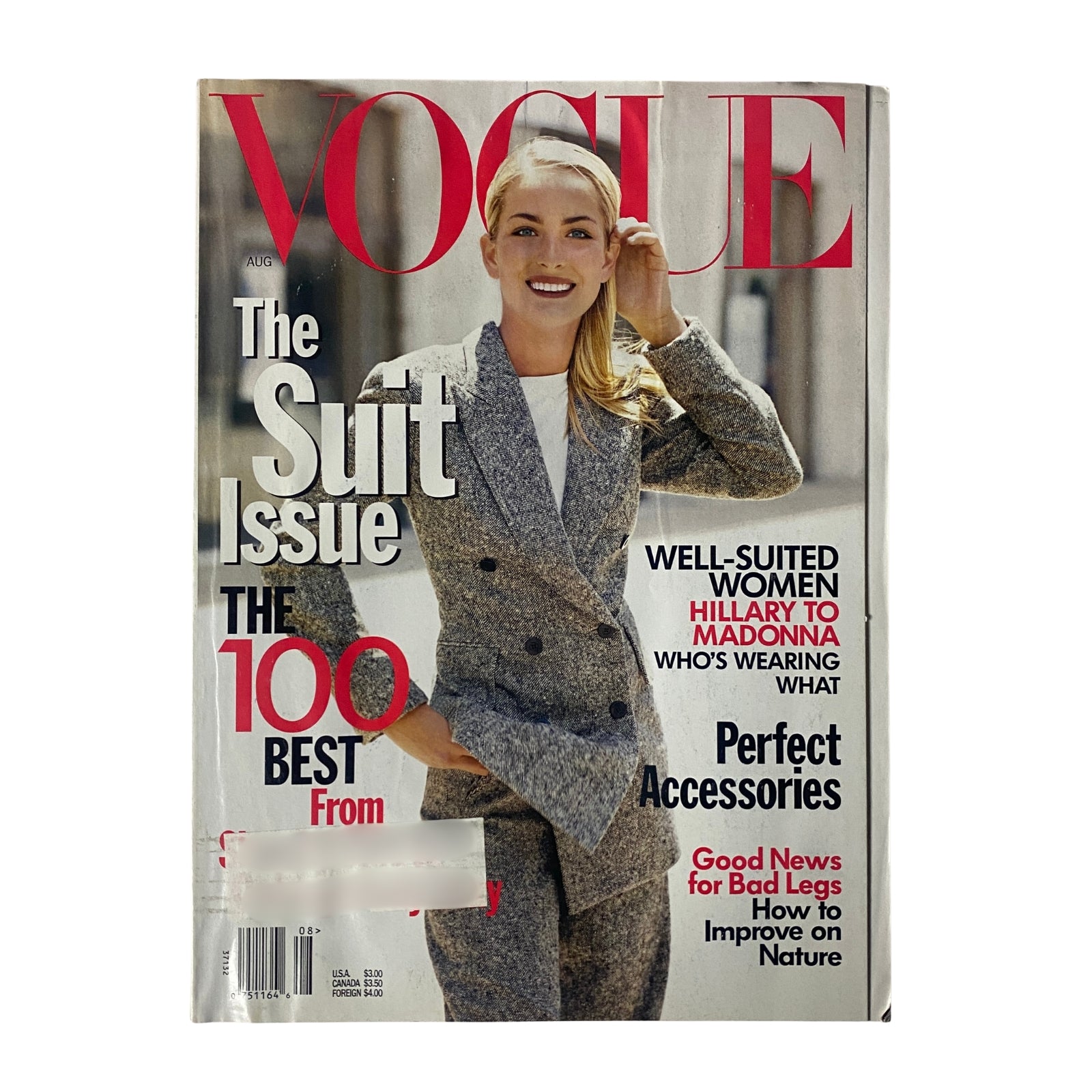 Vogue Magazine August 1997 cover featuring Georgina Grenville by Steven Meisel, showcasing a fashion-forward look with emphasis on the suit issue, highlighting style tips and iconic accessories.