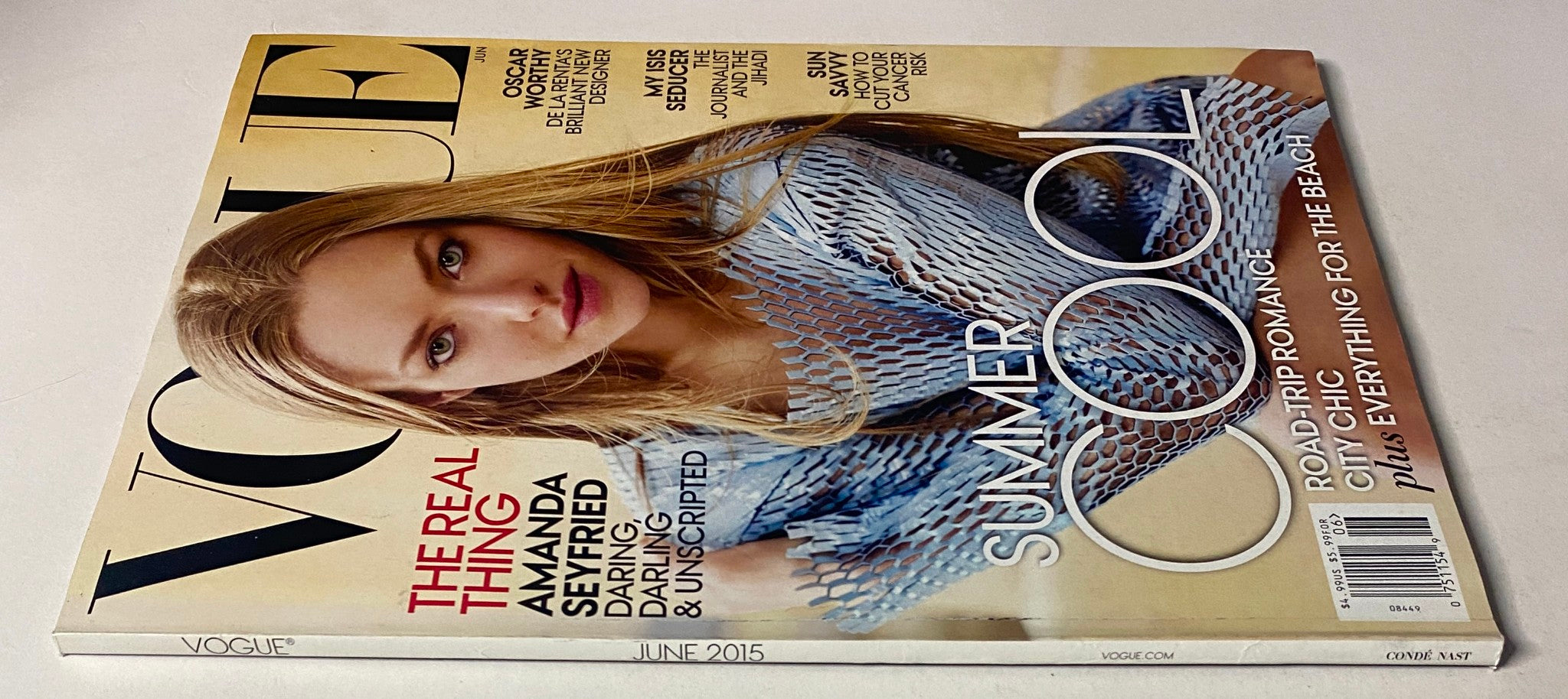 Vogue Magazine June 2015 featuring Amanda Seyfried on the cover in a summer-themed photoshoot, showcasing vibrant fashion styles.