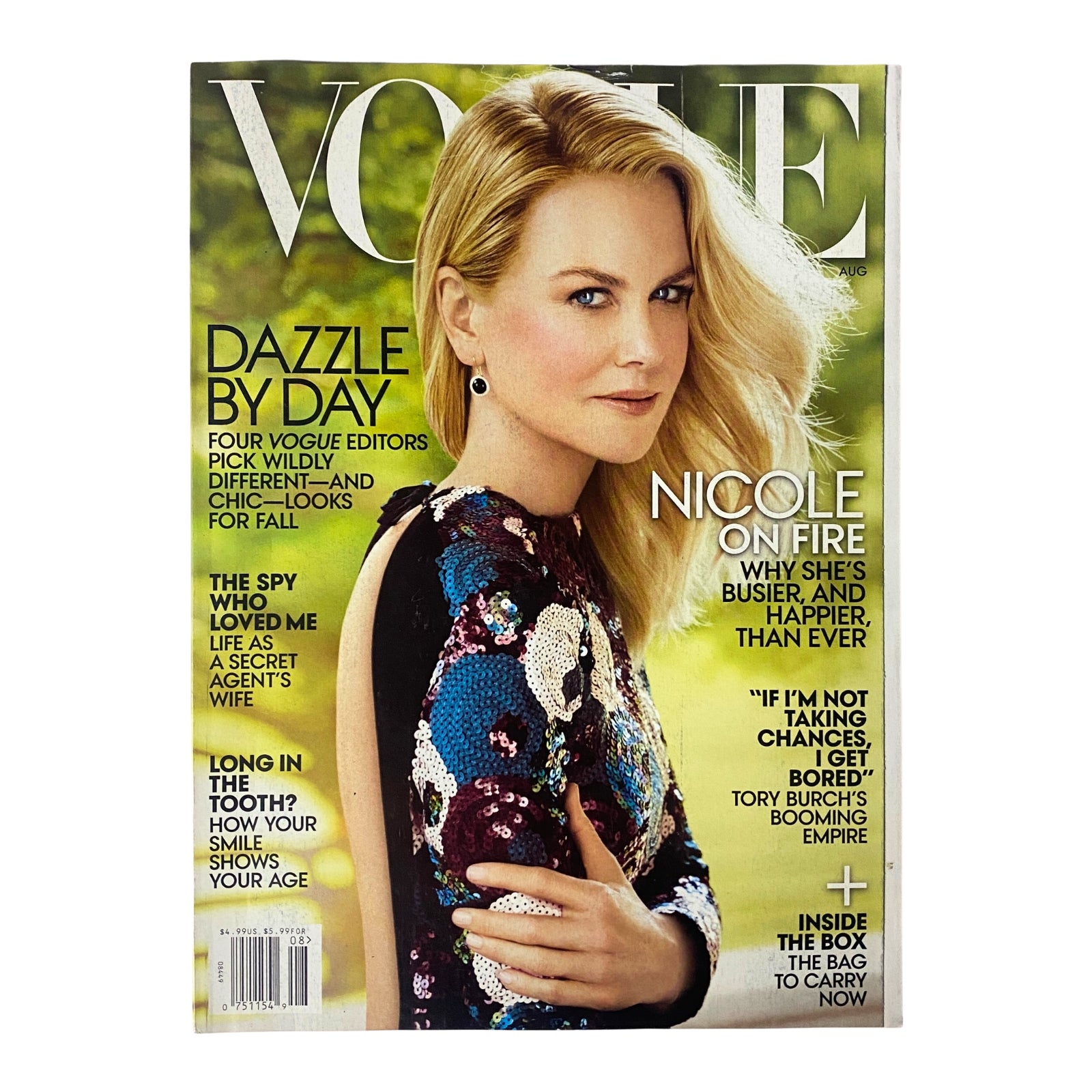 Vogue Magazine August 2015 cover featuring Nicole Kidman, showcasing her stunning look and fashion insights, highlighting the magazine's exploration of global fashion and culture.