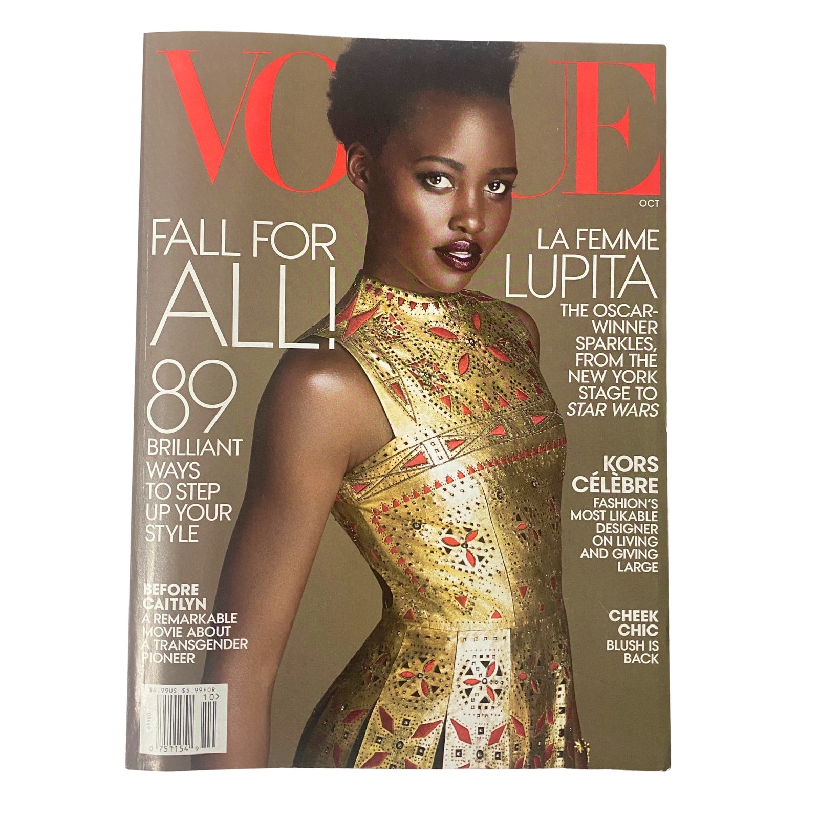 Vogue Magazine October 2015 featuring Lupita Nyong’o on the cover, showcasing her stunning couture dress. Design elements highlight the magazine's fashion theme.