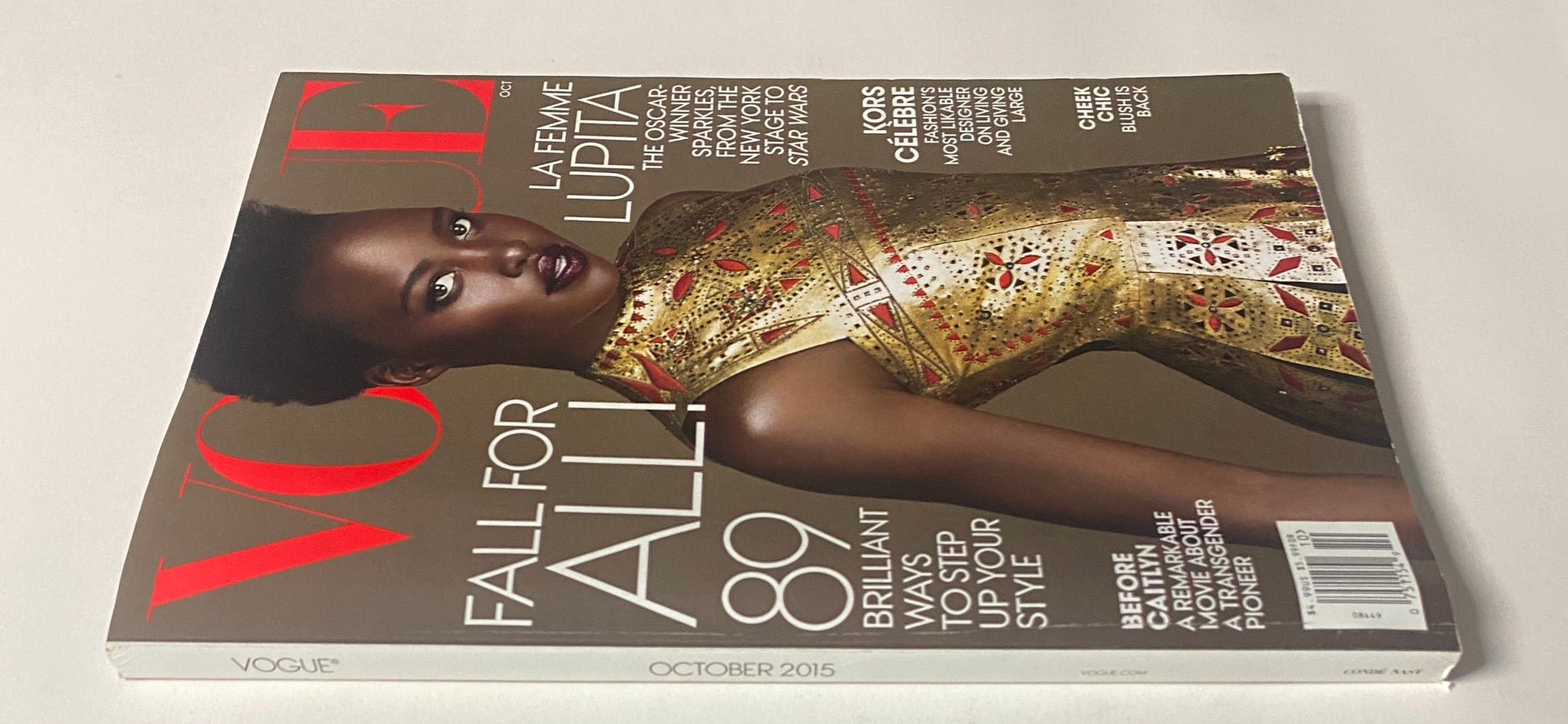 Side view of Vogue Magazine October 2015 with Lupita Nyong’o on the cover, emphasizing the magazine title and fashion content.