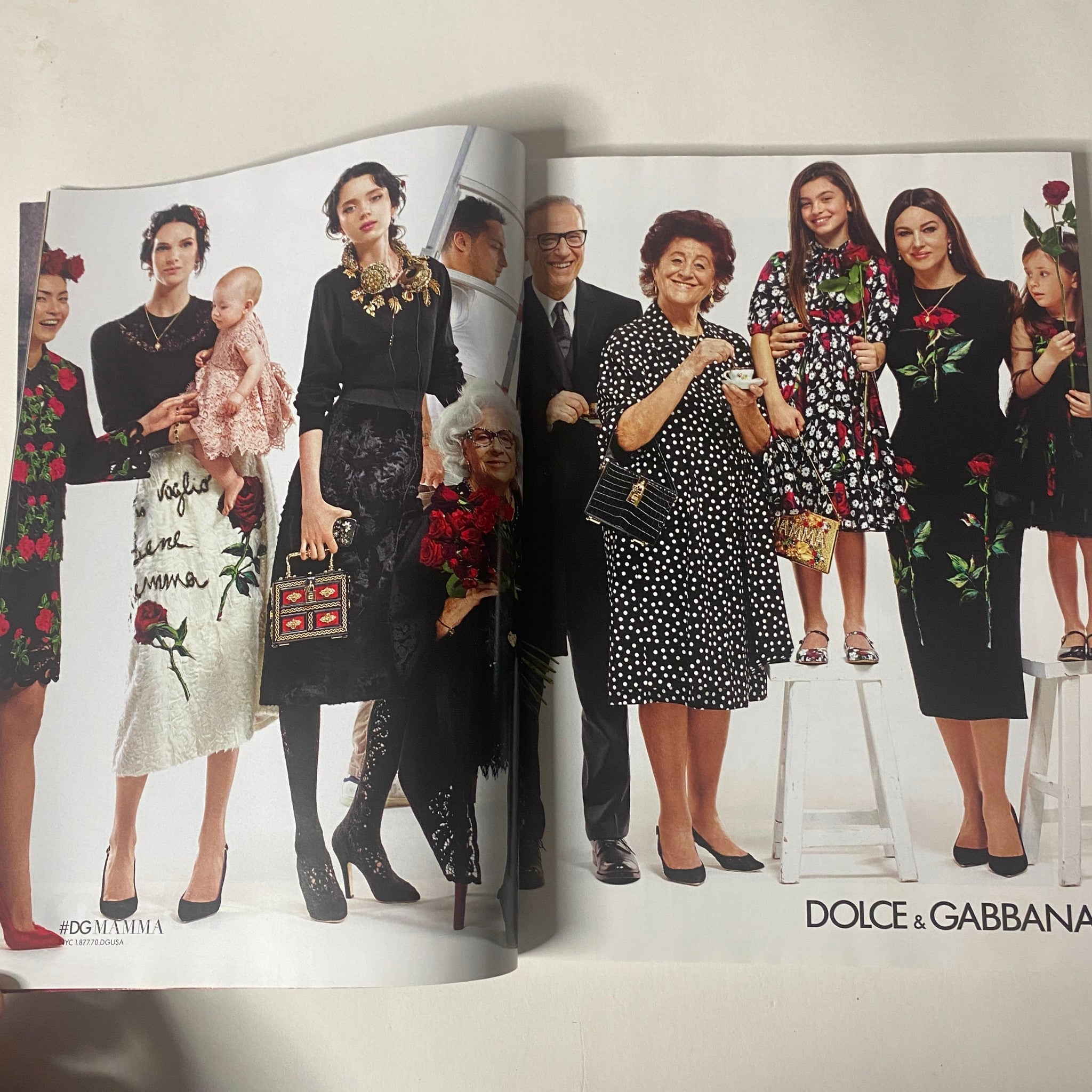 Vogue Magazine October 2015 Lupita Nyong'o Cover showing a fashion spread featuring Dolce & Gabbana designs, with a diverse group of models celebrating heritage and style.
