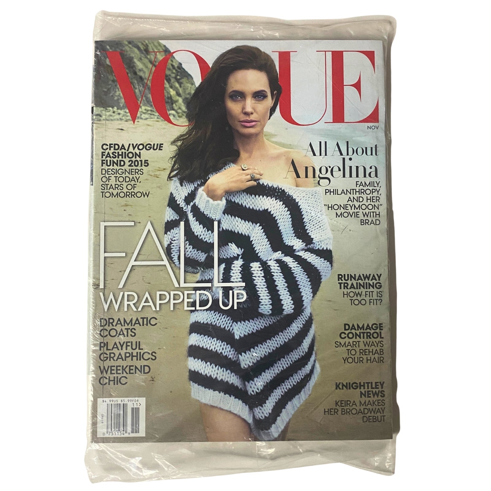 Vogue Magazine November 2015 featuring Angelina Jolie on the cover, showcasing fashion highlights, including fall coats and wellness content, sealed in pristine condition.