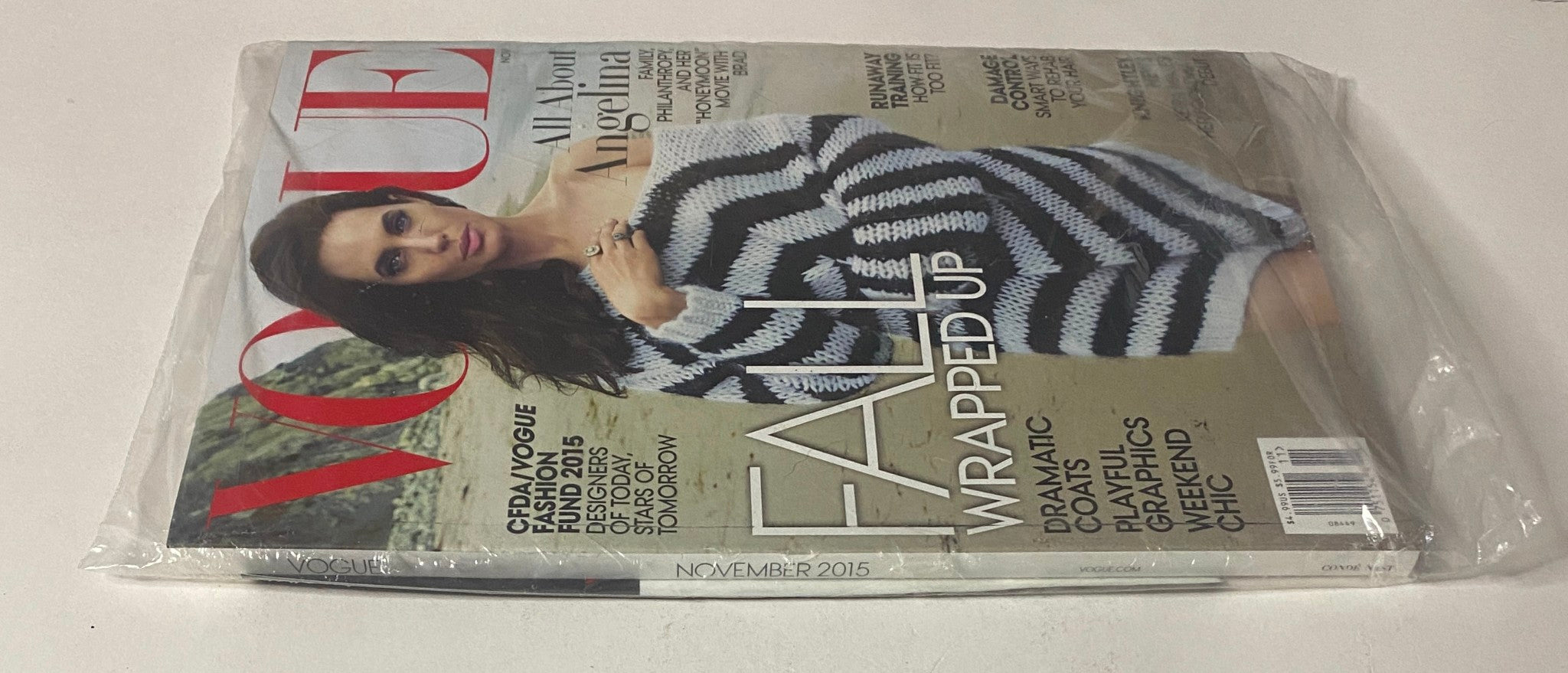 Vogue Magazine November 2015 Angelina Jolie Cover, sealed and in pristine condition, showcasing the cover star Angelina Jolie in a striped outfit.