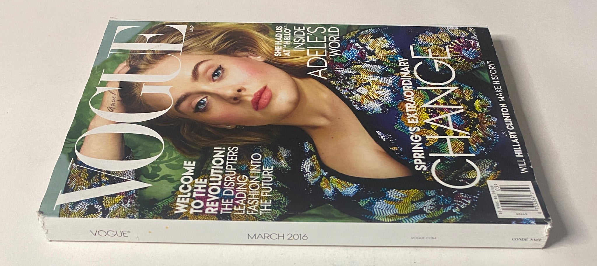 Vogue Magazine March 2016 Adele Cover, showcasing Adele's captivating presence in a bold outfit, reflecting trends in fashion and culture.