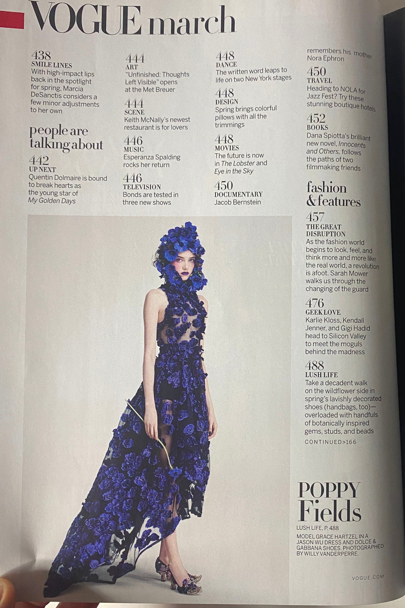 Fashion spread in Vogue Magazine March 2016 showcasing a model in a stunning blue floral dress for the feature 'Poppy Fields'.