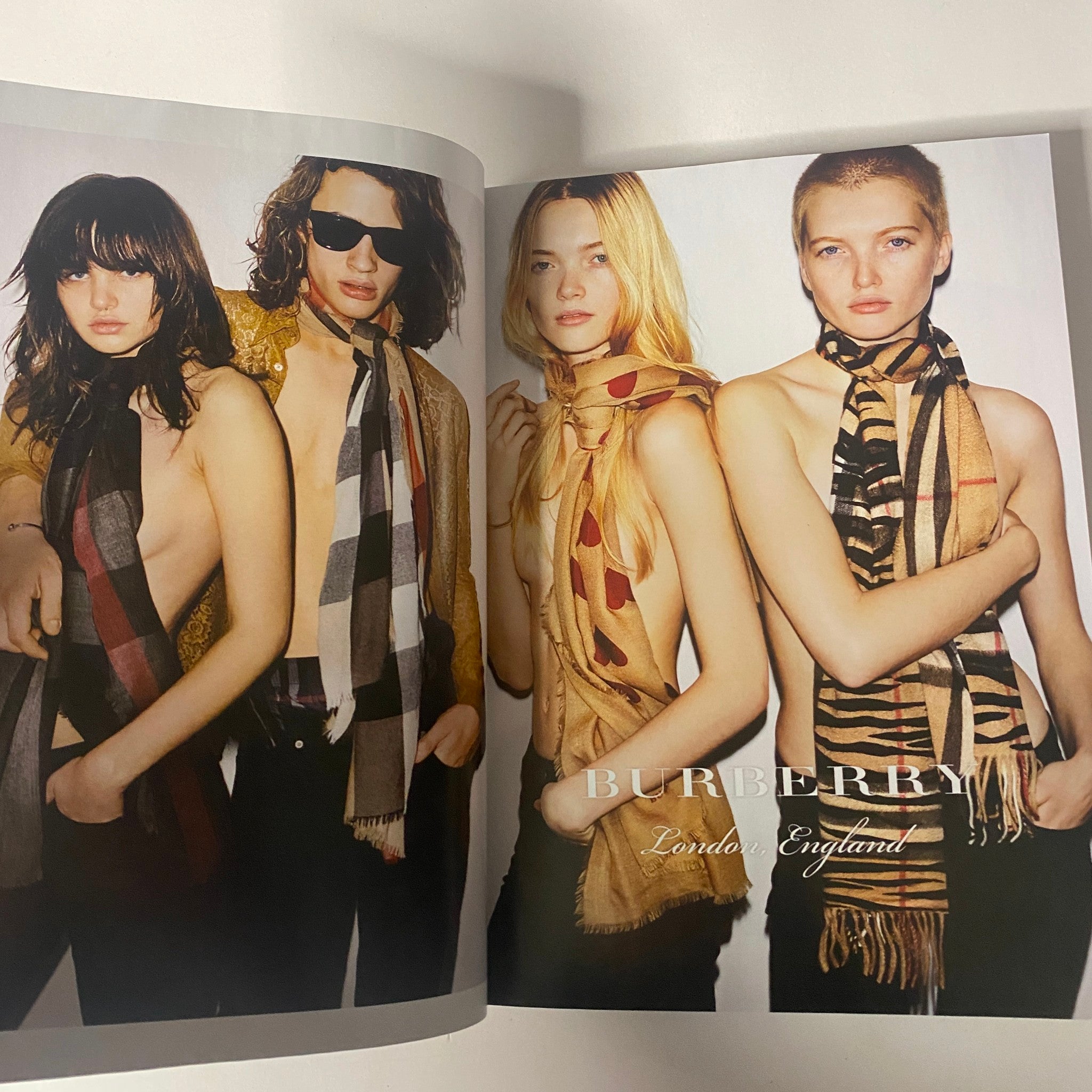 An editorial spread from Vogue Magazine March 2016 featuring models in Burberry scarves, focused on contemporary fashion styles.