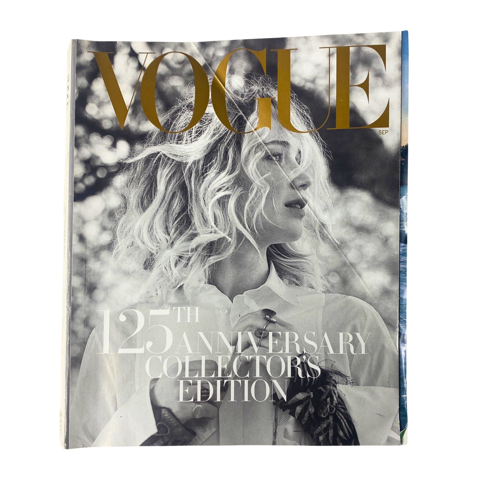 Vogue Magazine September 2017 Jennifer Lawrence Cover. A striking black-and-white portrait featuring Jennifer Lawrence with elegant hair and a stylish outfit, commemorating the 125th Anniversary Collector's Edition.