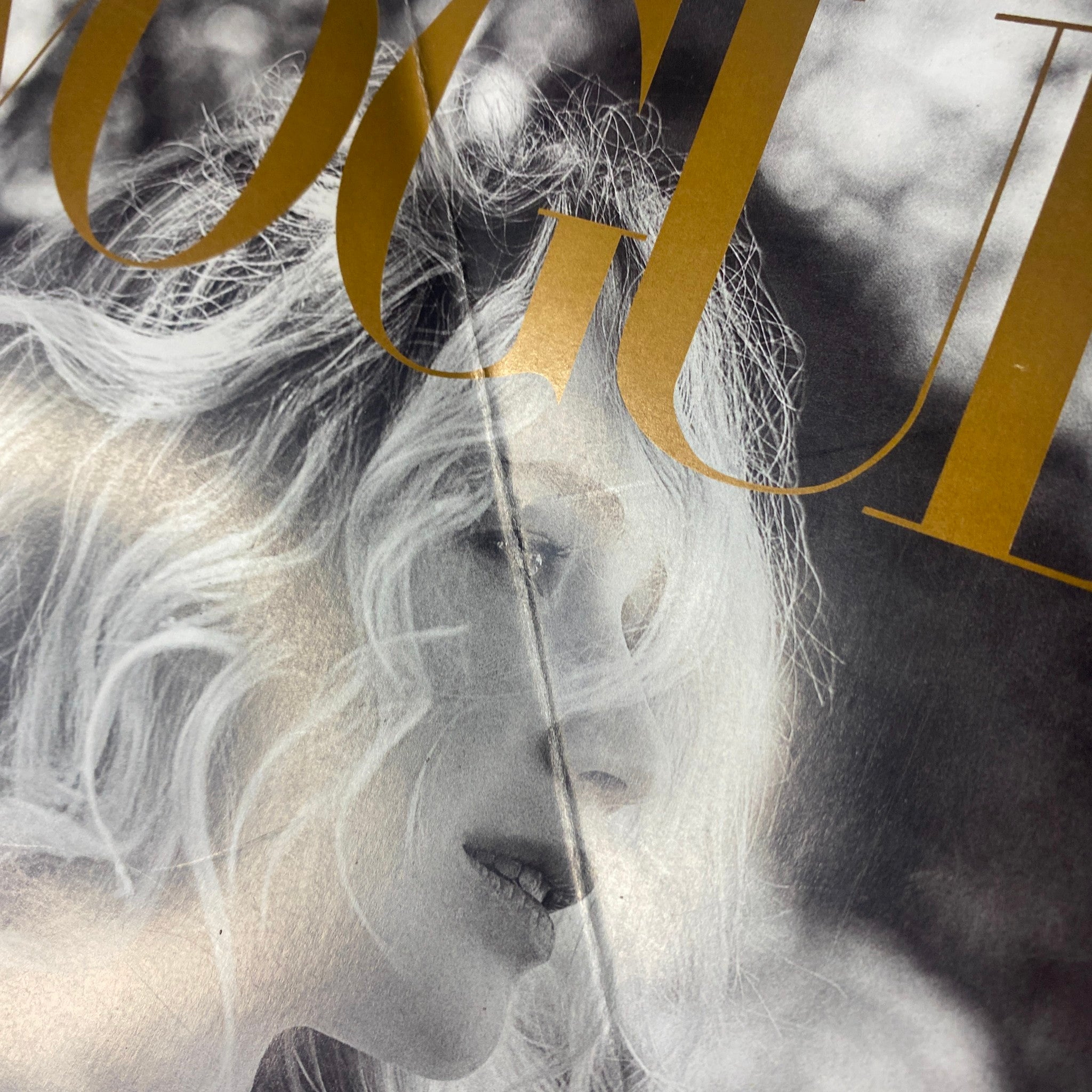 Close-up of the Vogue Magazine September 2017 cover, showcasing Jennifer Lawrence's profile in black-and-white with flowing hair, emphasizing her sophisticated look for the 125th Anniversary Collector's Edition.