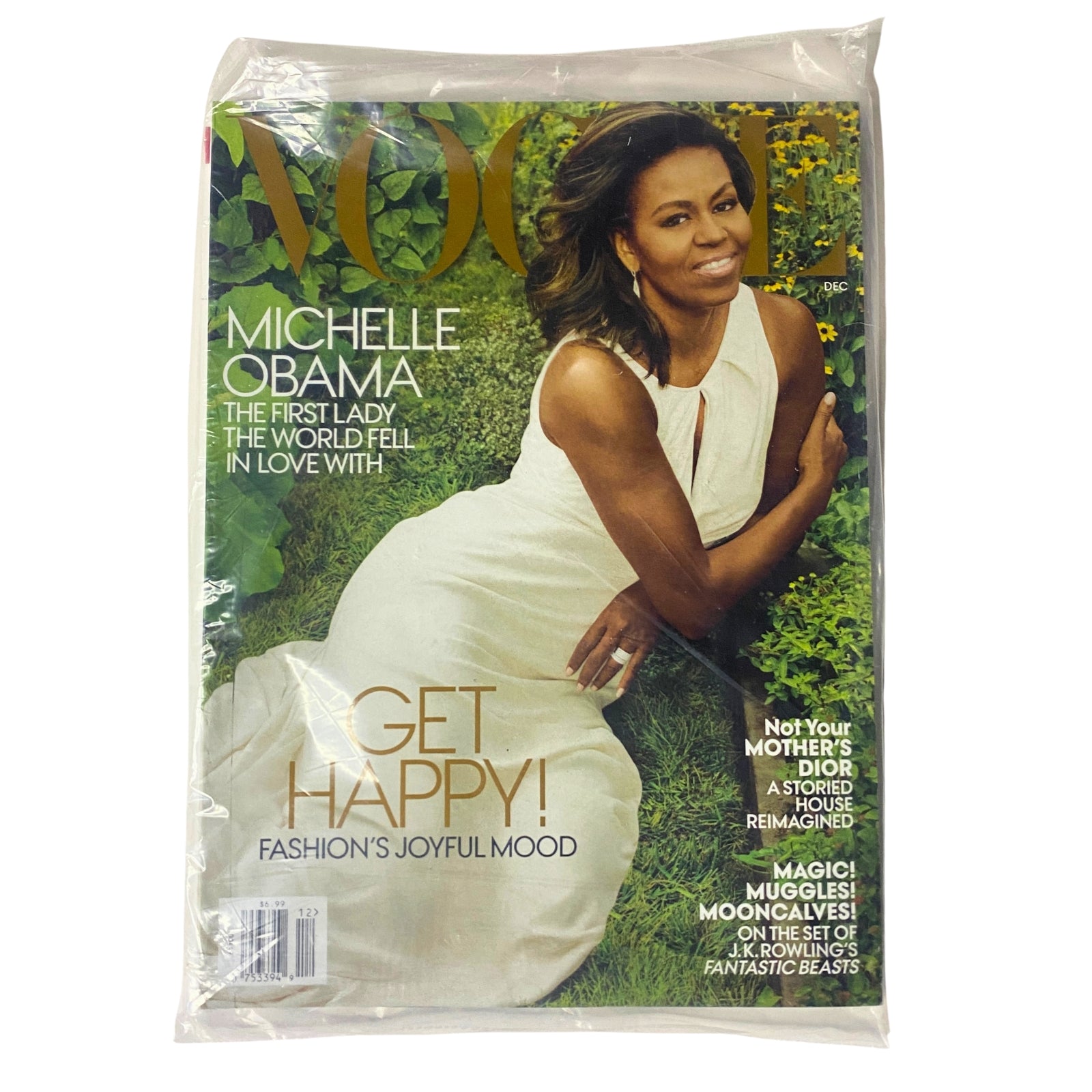 Vogue Magazine December 2016 featuring Michelle Obama on the cover, showcasing her in a white dress, celebrating her legacy as First Lady. This collectible issue emphasizes a joyful fashion theme.